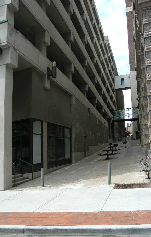  The Commons, downtown Kansas City :: 2012.  The view up the alley from Baltimore Avenue before our intervention. Our design goal was first to turn a neglected space into one that is engaging and hospitable. We saw the sloping pavement surface as a c