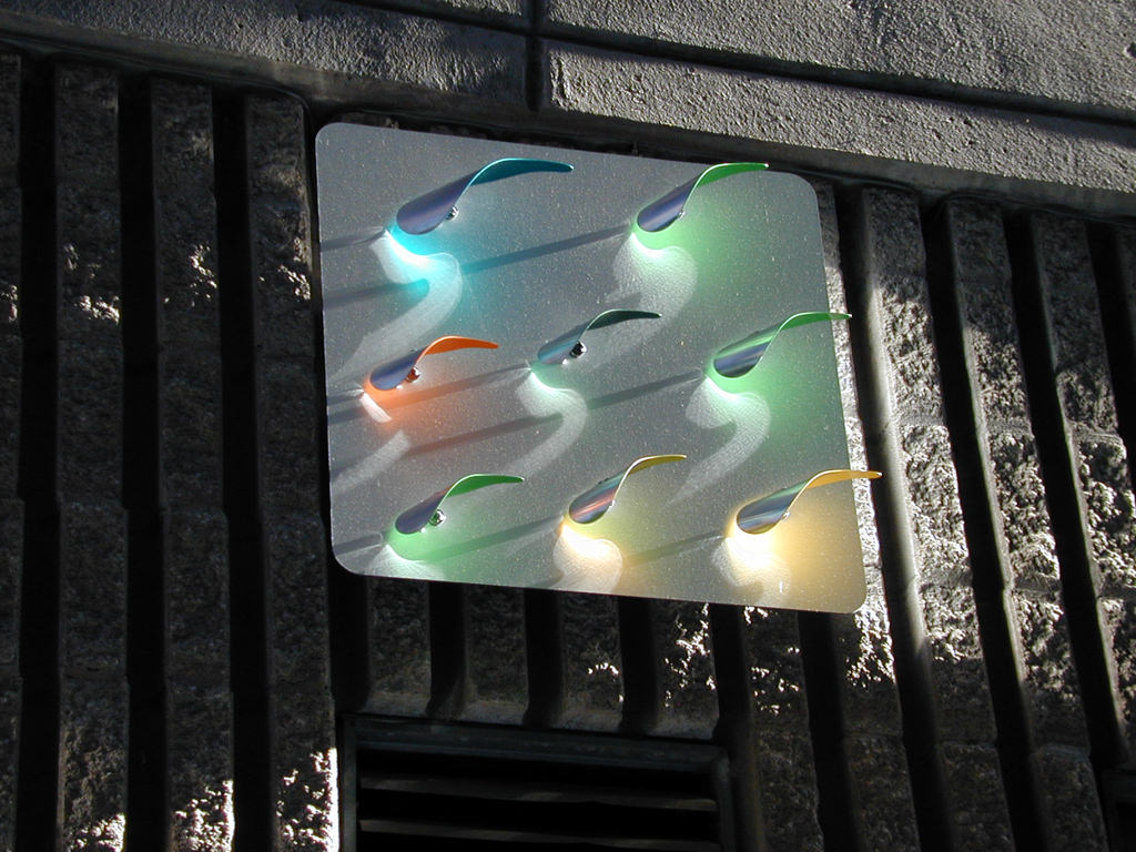  The Commons, downtown Kansas City :: 2012.  Close up on a Ghost Birds sculpture panel, late afternoon light, no illumination. The curved sculptural forms use bearings and a counterweight system to rock gently in the wind. 