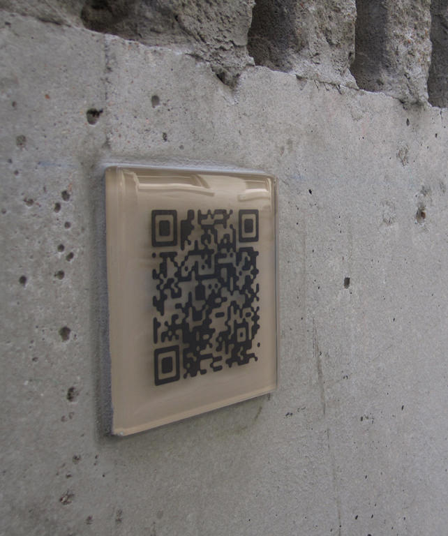   The Commons, downtown Kansas City :: 2012.   Close up on a QR story tile. Small glass tiles mounted on the alley wall also use QR (quick response) codes to connect visitors directly with the audio files of the “ghost stories”. We recorded school ch