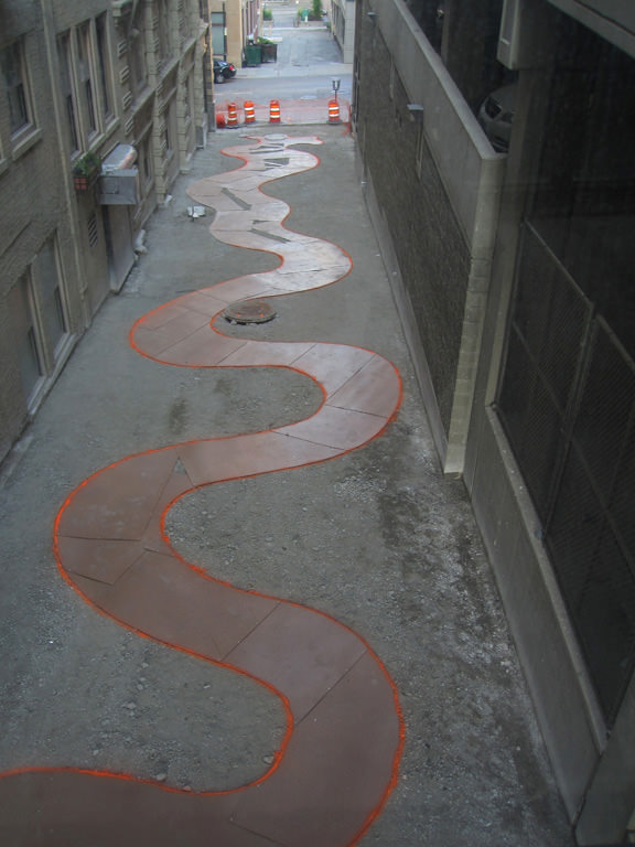  The Commons, downtown Kansas City :: 2012.  Alley from rear, slightly above, stream template in place. This method also allowed us to easily visualize the design on site prior to implementation. 