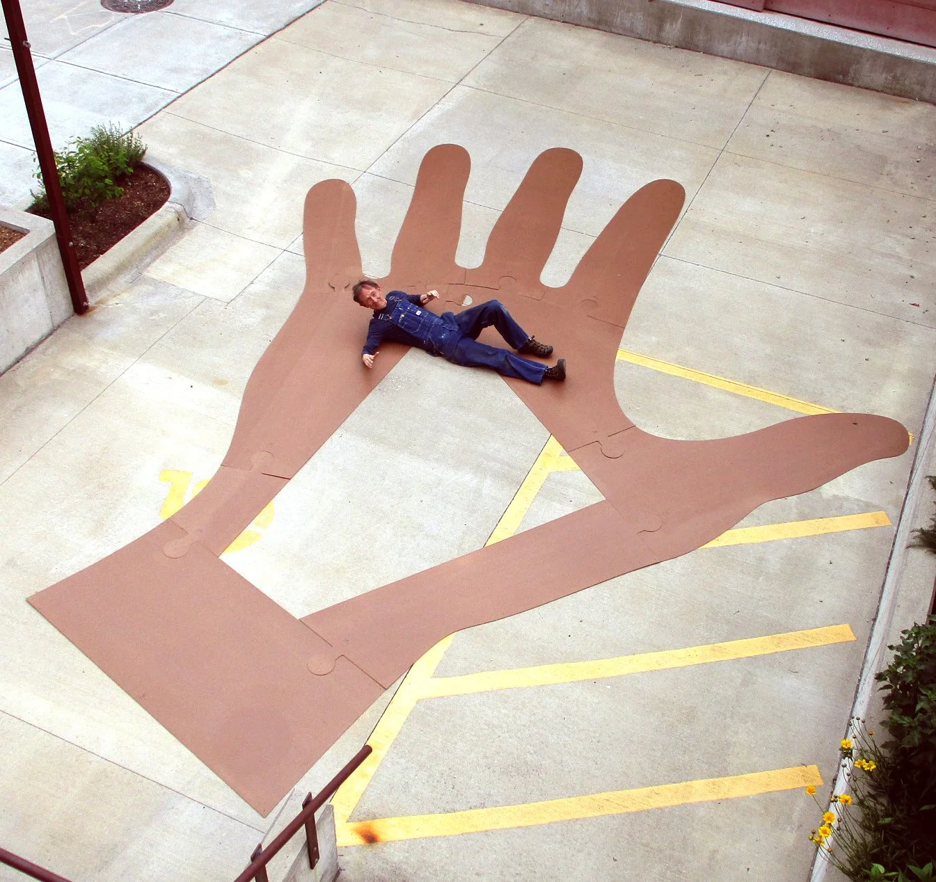  Mutual Aid, Lykins Square Park, East 8th Street and Norton Ave, Kansas City, MO :: 2024    For the large ground art, we prepared a hardboard template for each reaching hand. 