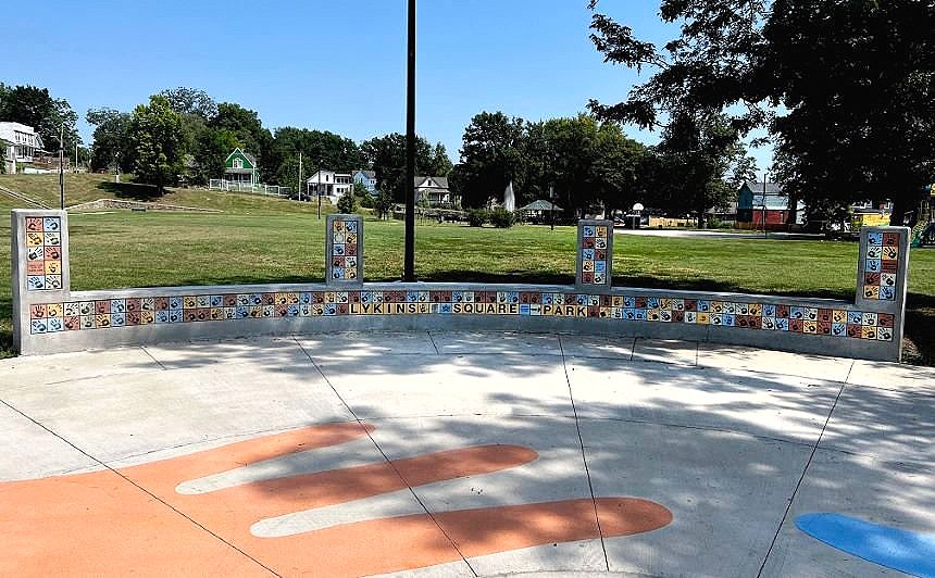 Mutual Aid, Lykins Square Park, East 8th Street and Norton Ave, Kansas City, MO :: 2024 It consists of a circular plaza in the middle of Lykins Square Park, with benches, concrete surface design, and 608 high-fire ceramic tiles.