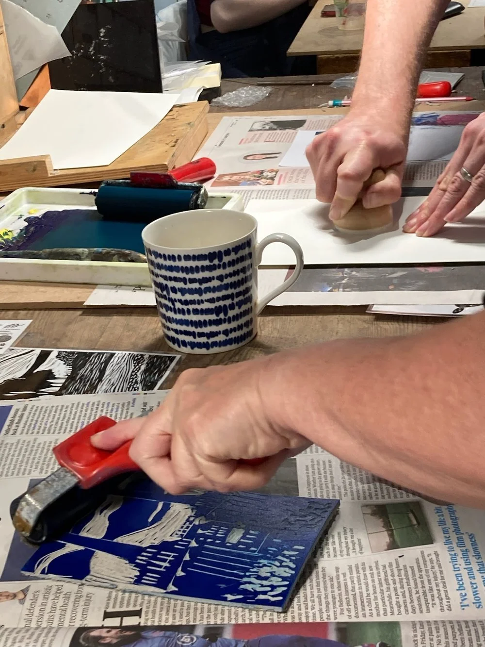 Lino Printing workshop rolling out the ink.jpeg