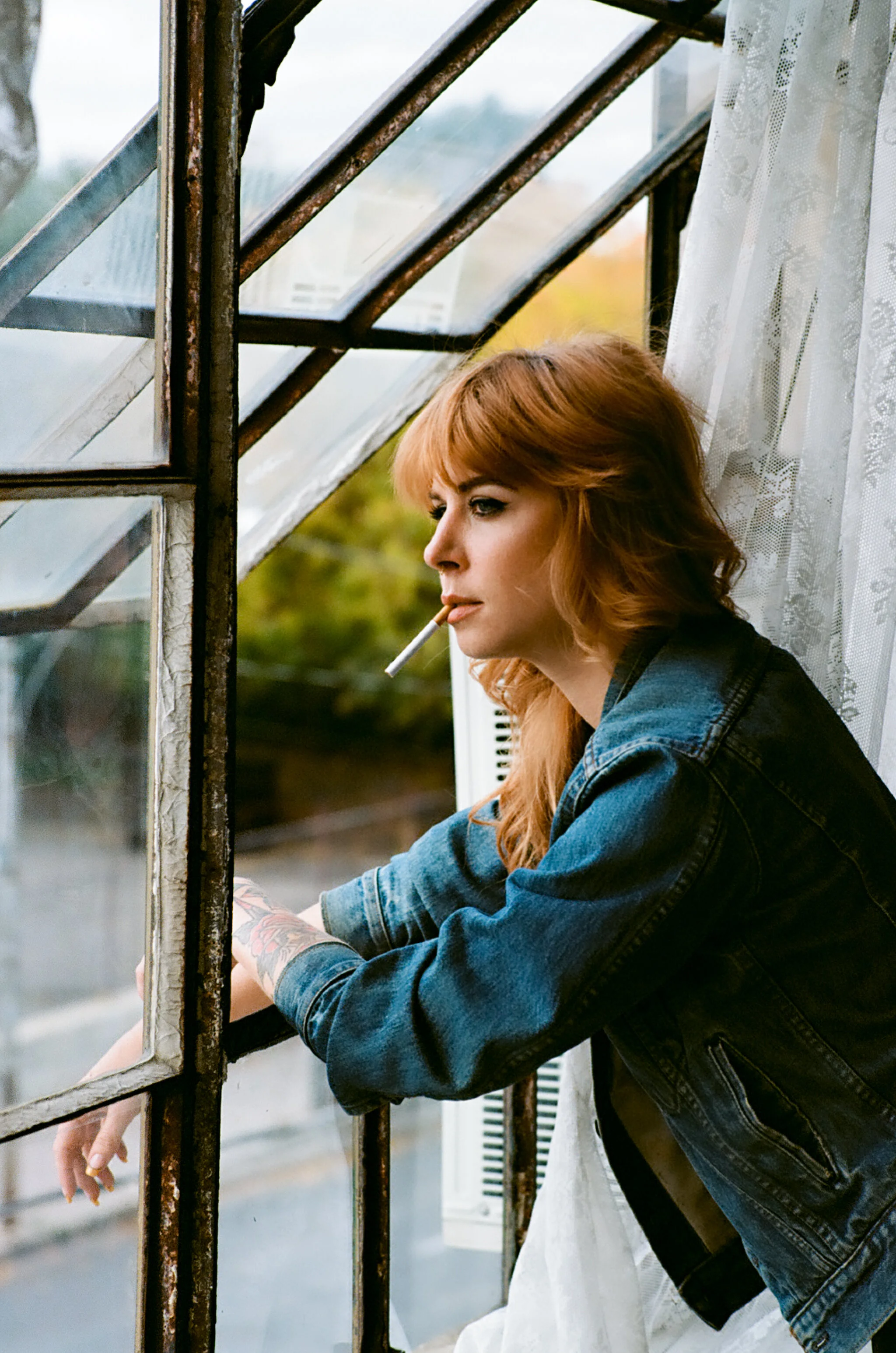 Portrait of Redhead Woman in Denim Jacket Cigarette