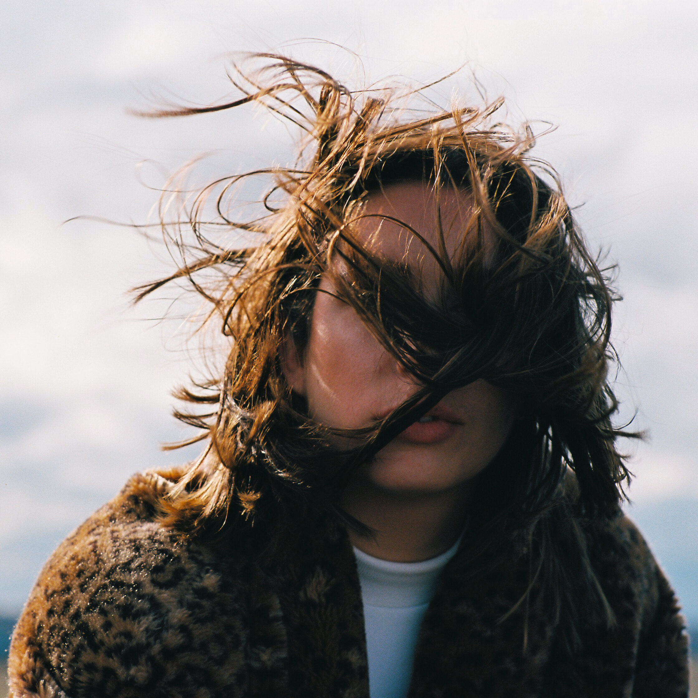 Portrait of Woman with Windy Hair Leopard Coat