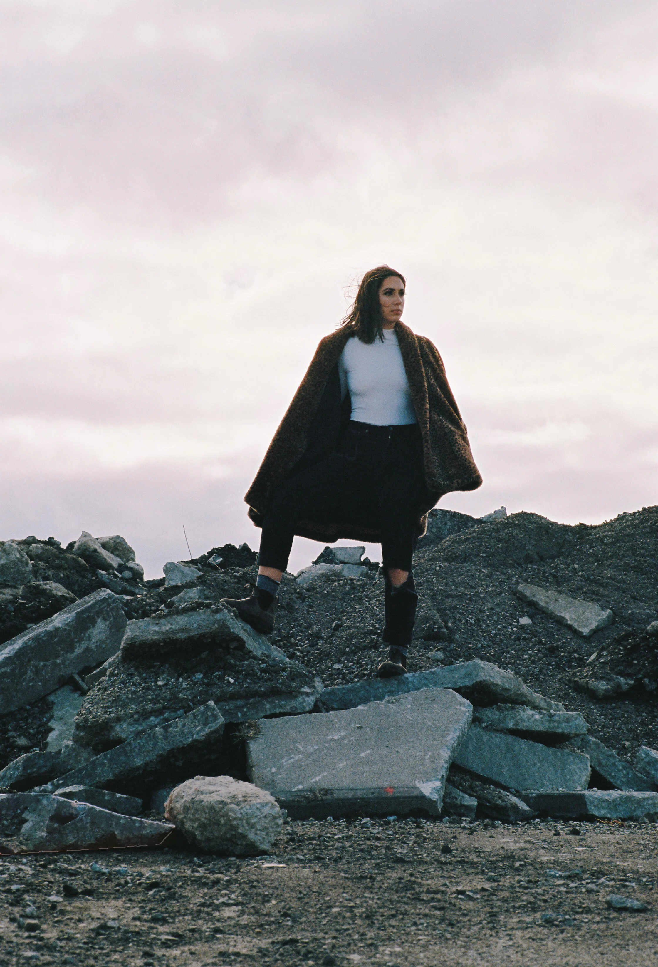 Portrait of Woman in Leopard Coat on Gravel