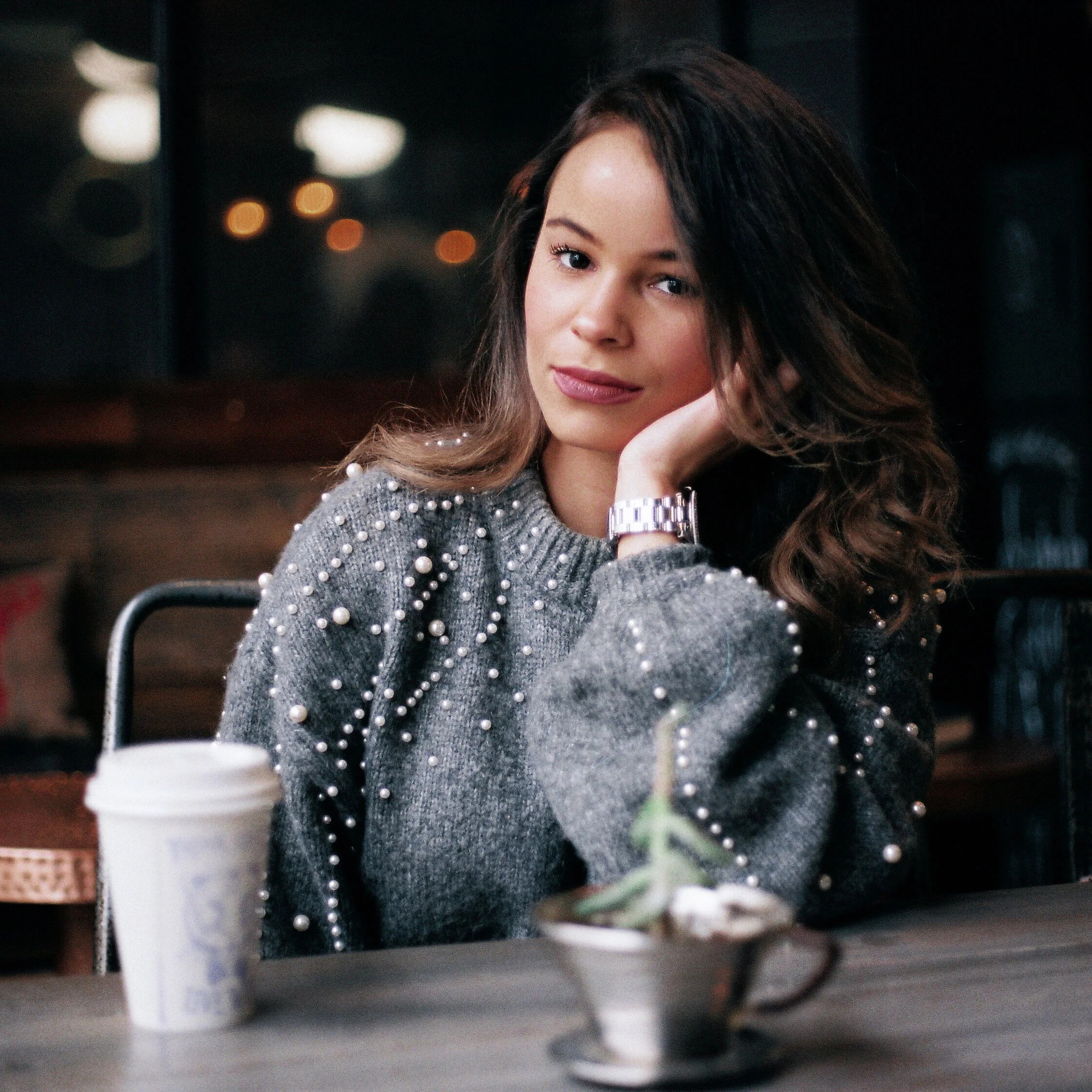 Portrait of Woman Looking into Lens at Cafe