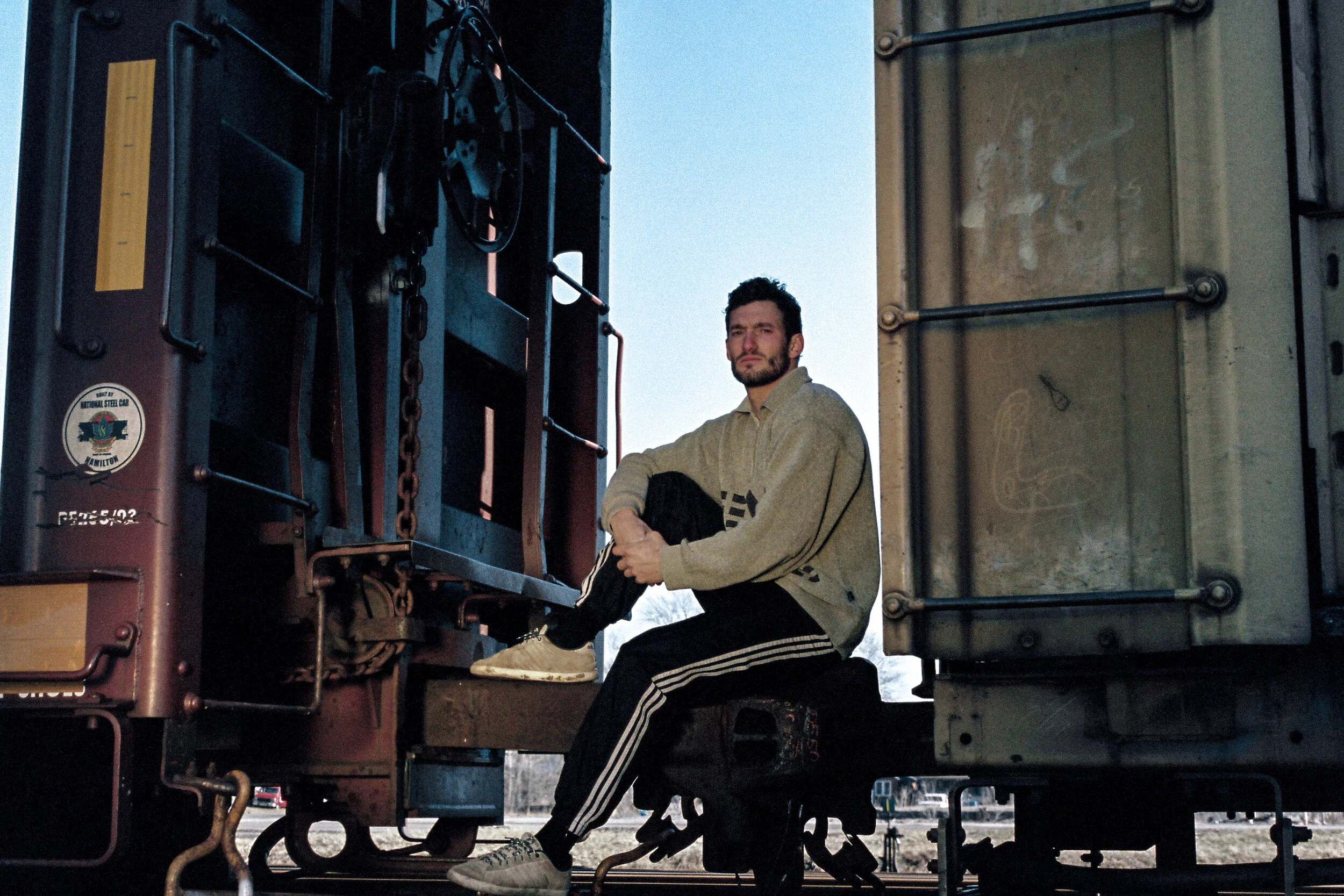 Portrait of Man Sitting in Train Cars