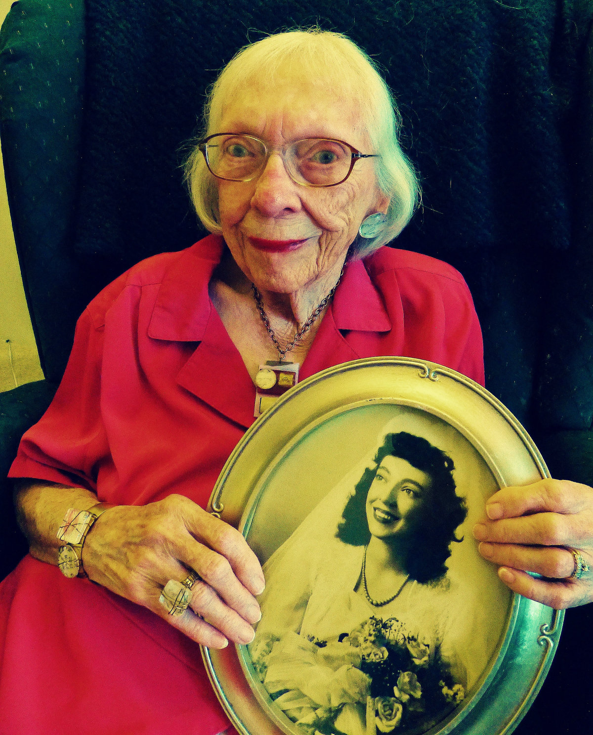   Grandma holding her wedding photo.  