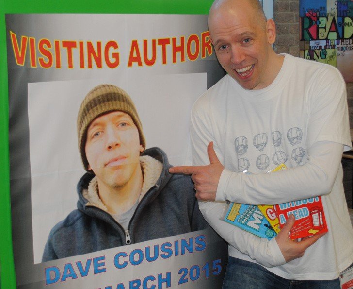 Dave-cousins with poster of himself.jpg
