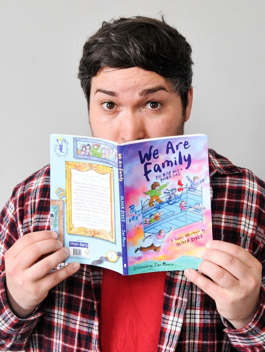 Oliver reading we are family.jpg