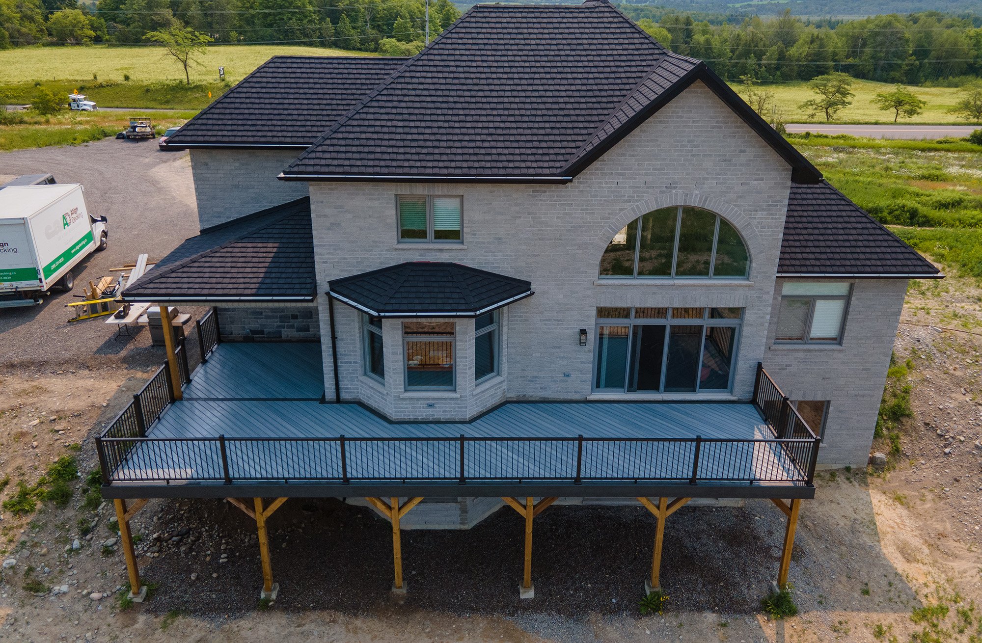 Wrap-around Trex Composite Deck with TimberTech Aluminum Railings in Sunderland, Ontario