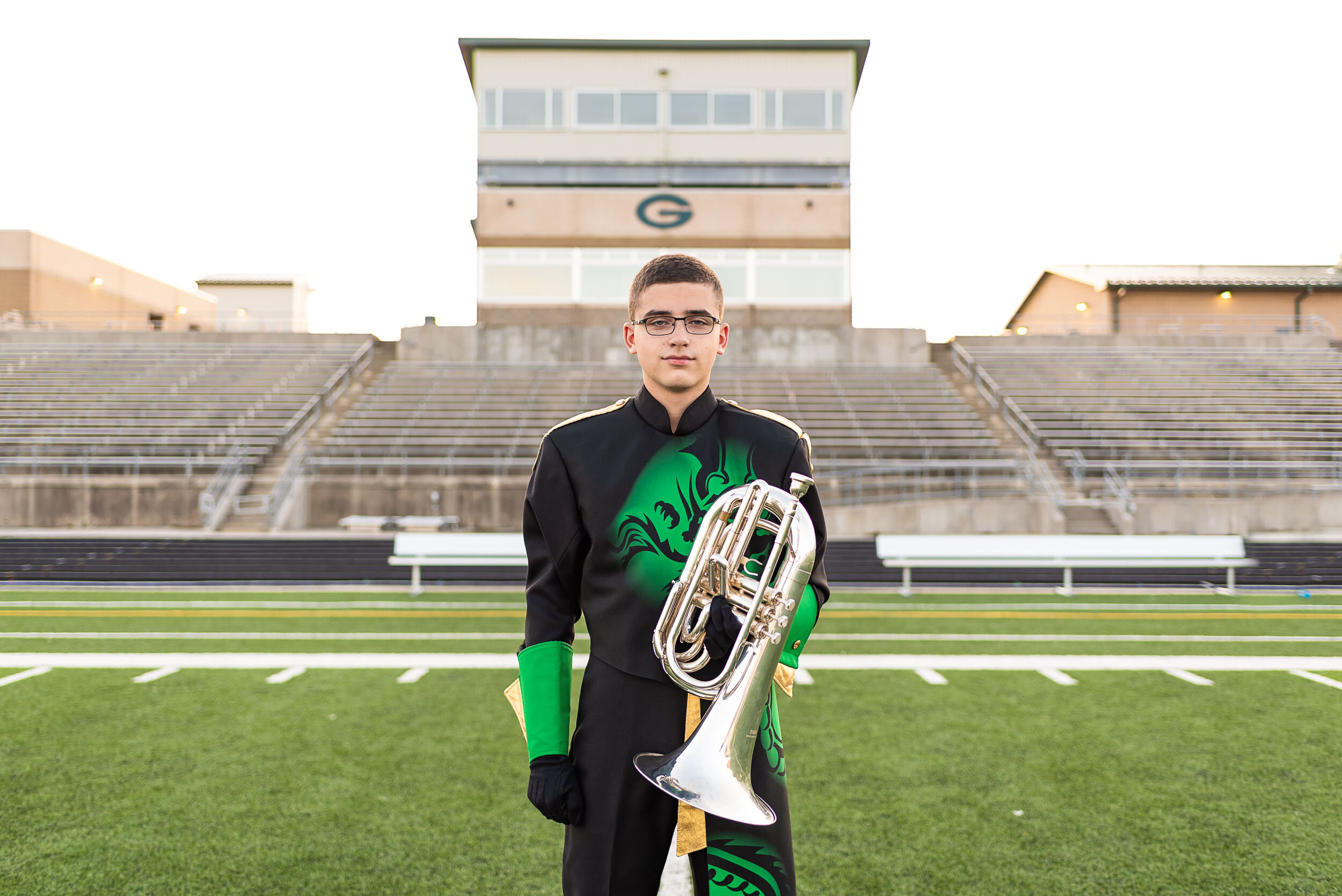 high-school-senior-guy-band-uniform-football-field-gretna-green-black-Jill-Carson-Photography.jpg