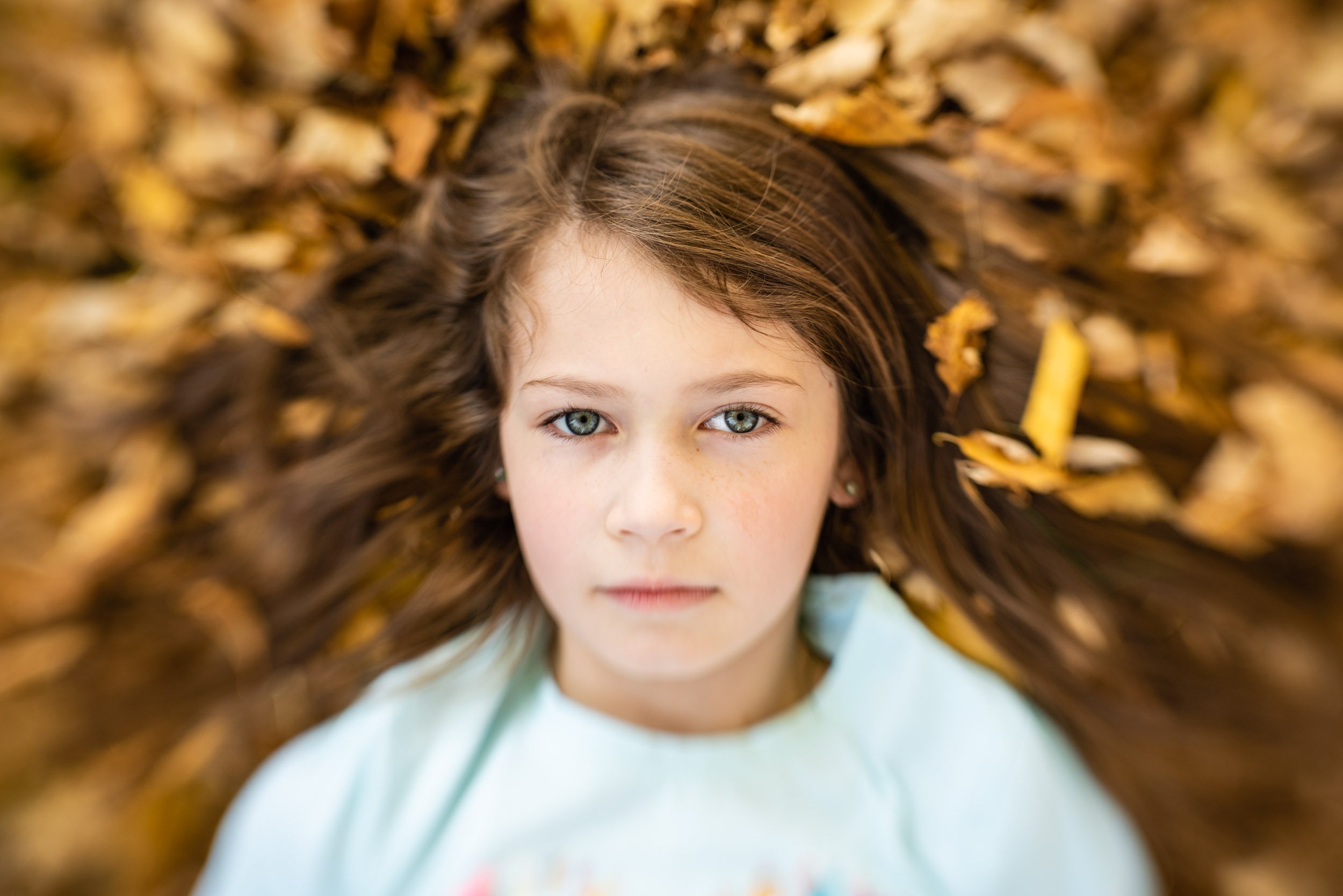 Omaha child portrait in leaves