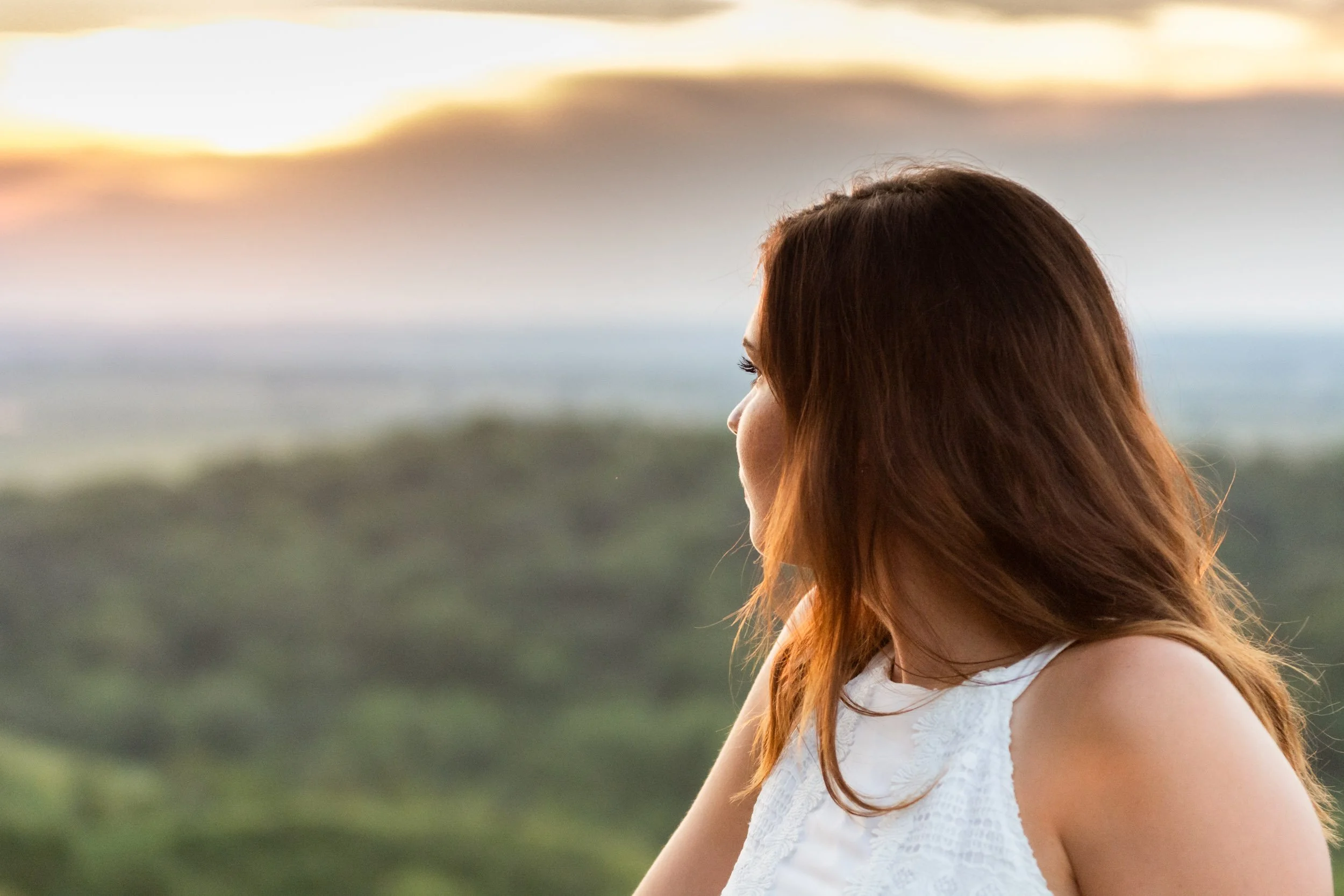 teen-looking-out-to-sunset.jpg