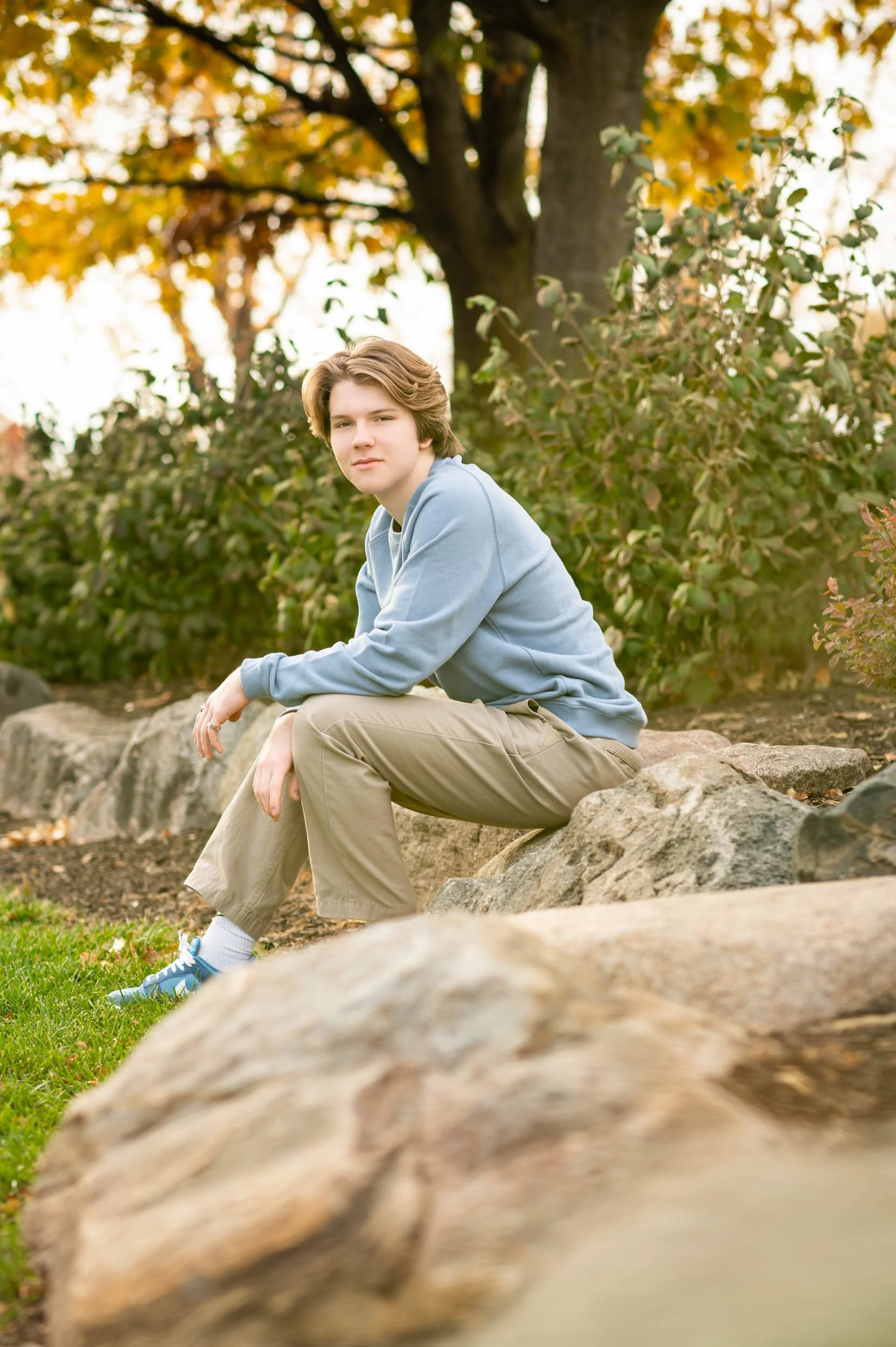 senior-guy-grove-park-seated-rocks.jpg