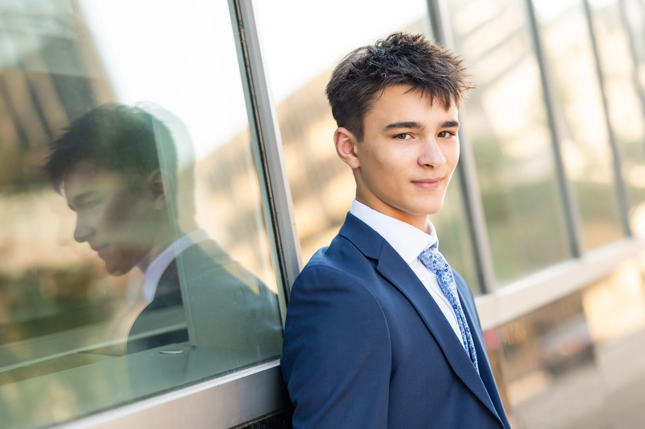 senior-high-school-boy-leaning-glass-reflection.jpg