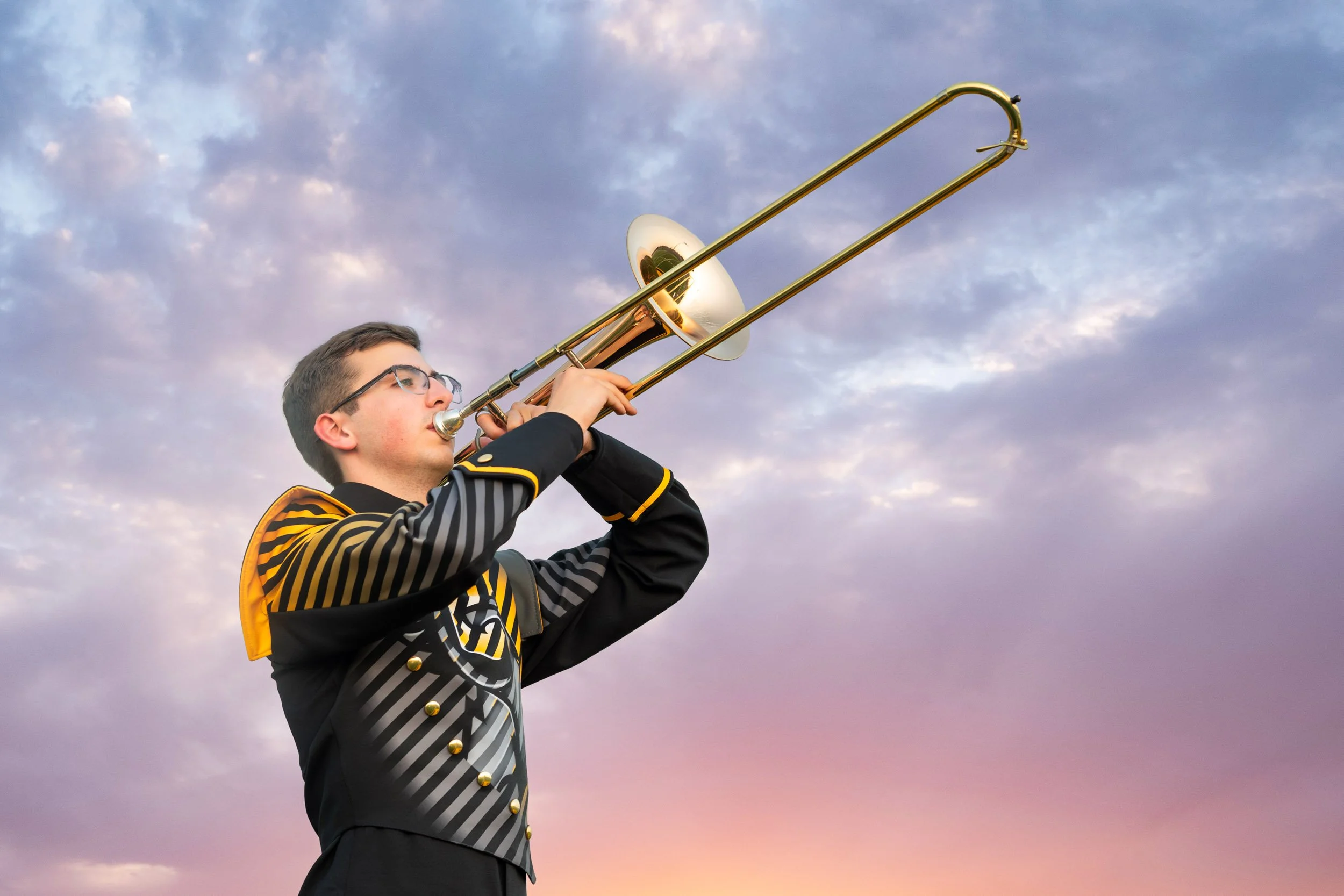 senior-guy-gretna-east-trombone-marching-band-instrument-dramatic-sky.jpg
