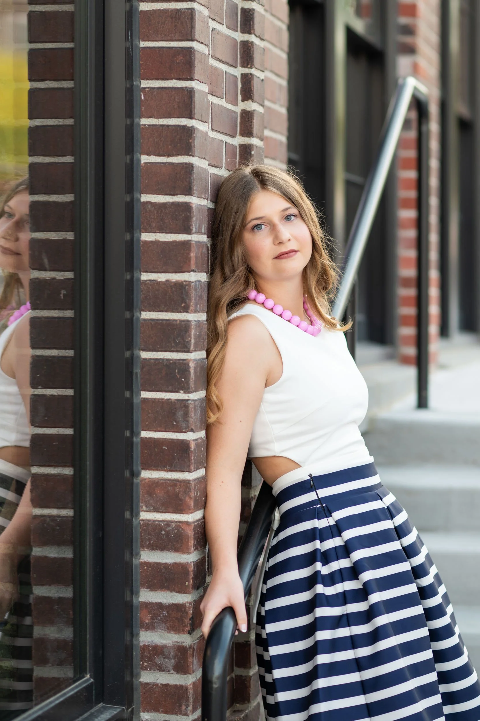 senior-girl-exterior-omaha-public-library-reflection.jpg