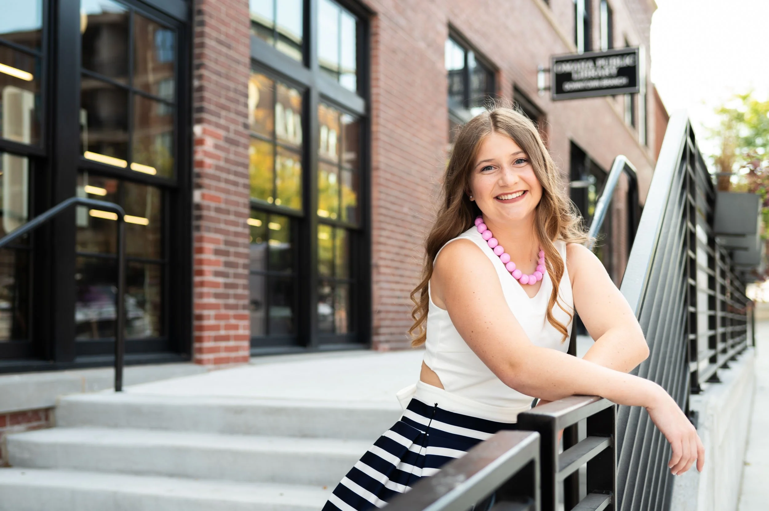 senior-girl-exterior-omaha-public-library.jpg