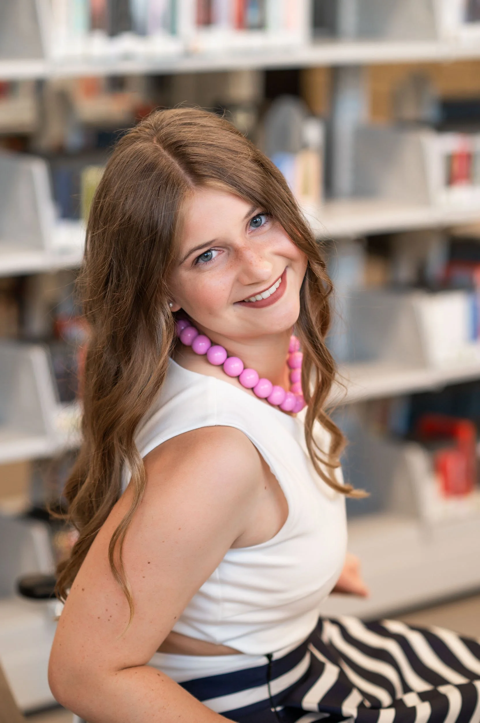 senior-girl-books-omaha-public-library.jpg