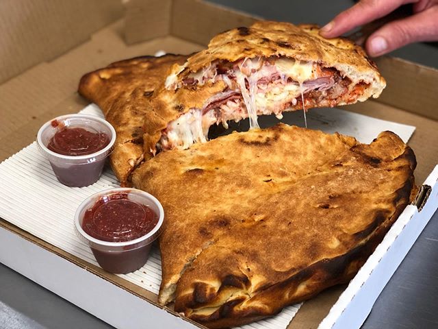 Our LARGE calzone! (Size comparison to Megan&rsquo;s hand LOL) Enough to feed 3 people for 15$! 🤤 this one is a meat lovers but you can pick anything you want in these bad boys! Comes in small, medium, and large! 🤩 #yum #calzone #pizza #fresh #loca
