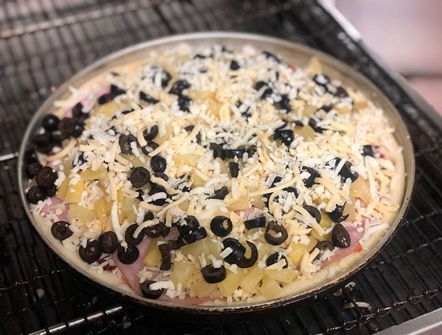 Our Hawaiian with black olives going into the oven on this chilly Wednesday evening! #pizza #fresh #hawaiian #yyj #local #yummy