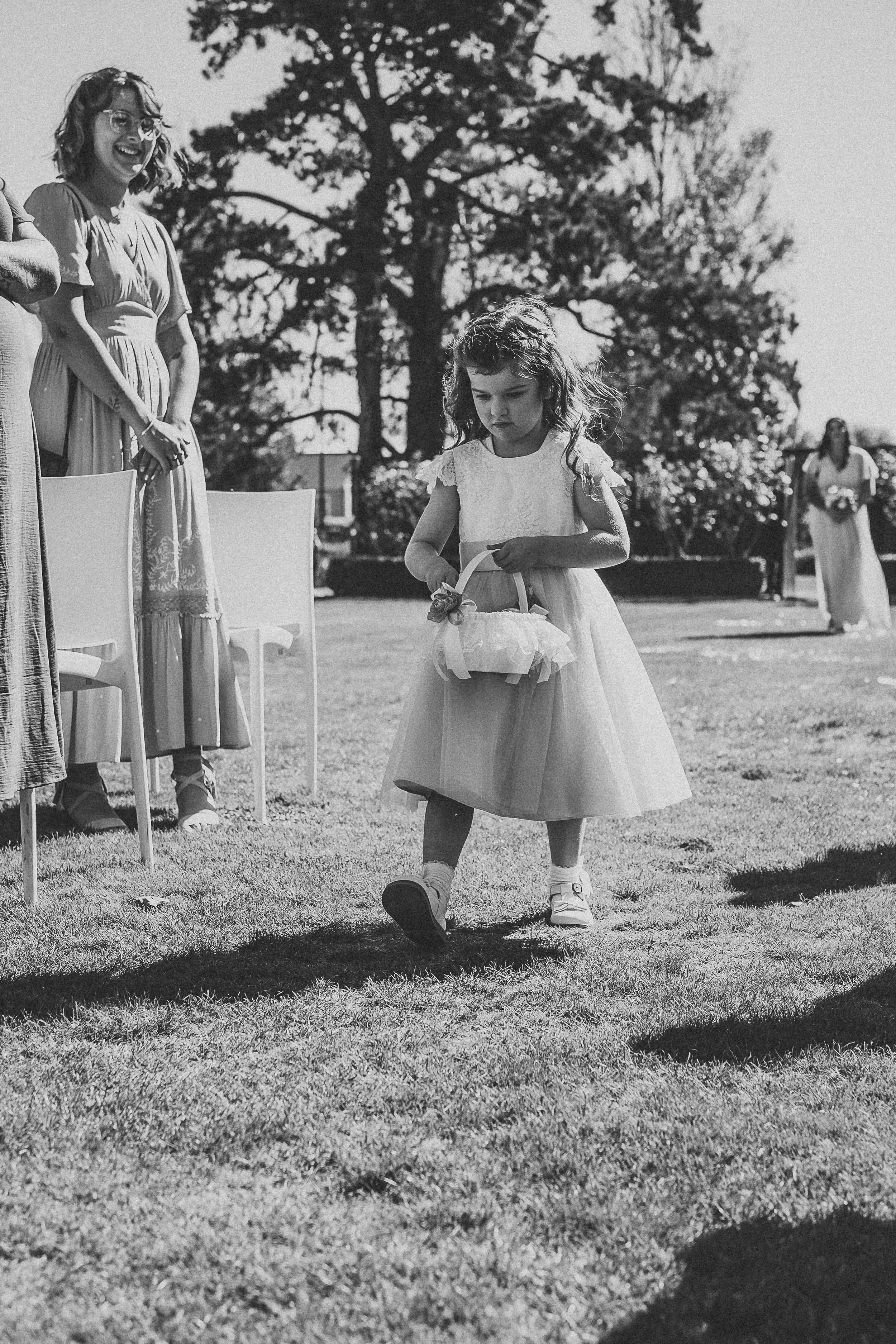 Flower girl throwing petals down the isle