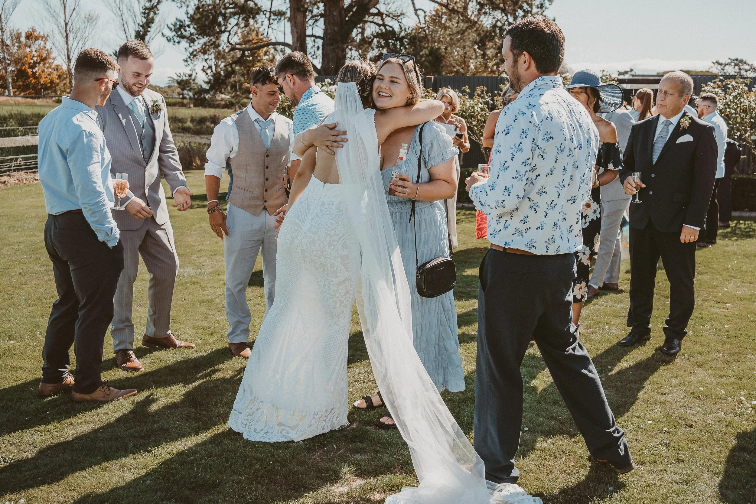 Friends celebrating after bride and groom have tied the knot