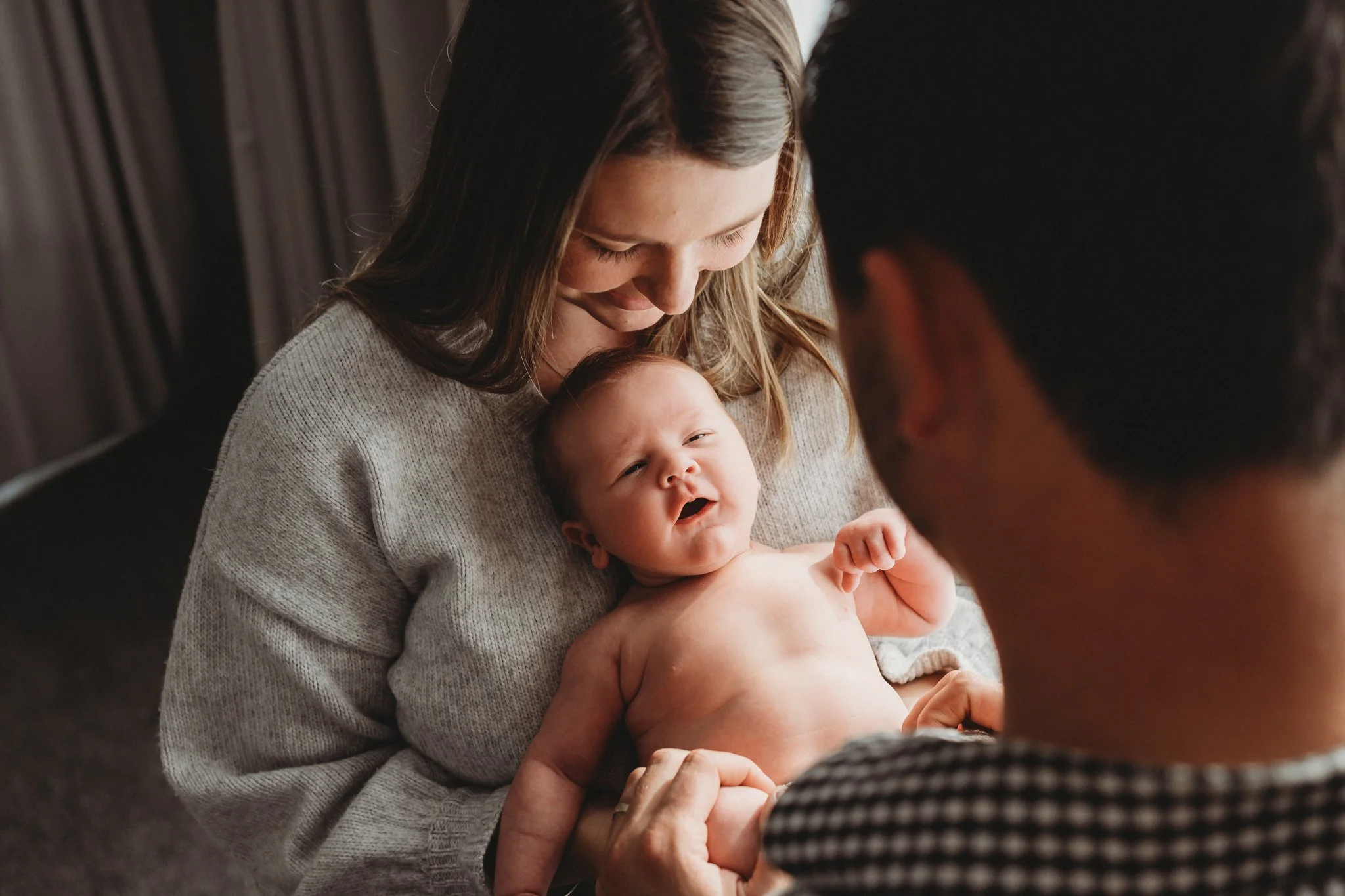 Sleepy smiles between parents