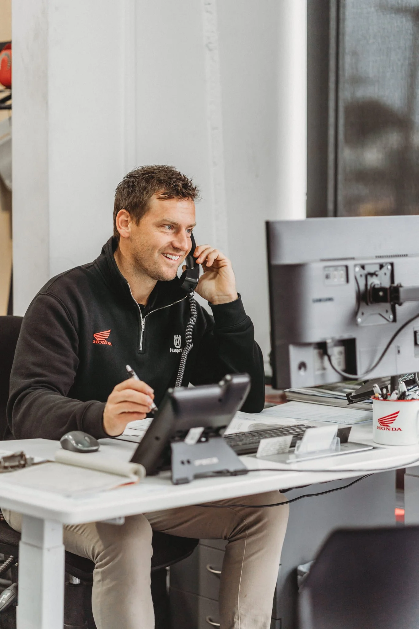 Casual employee shot of salesman talking on the phone