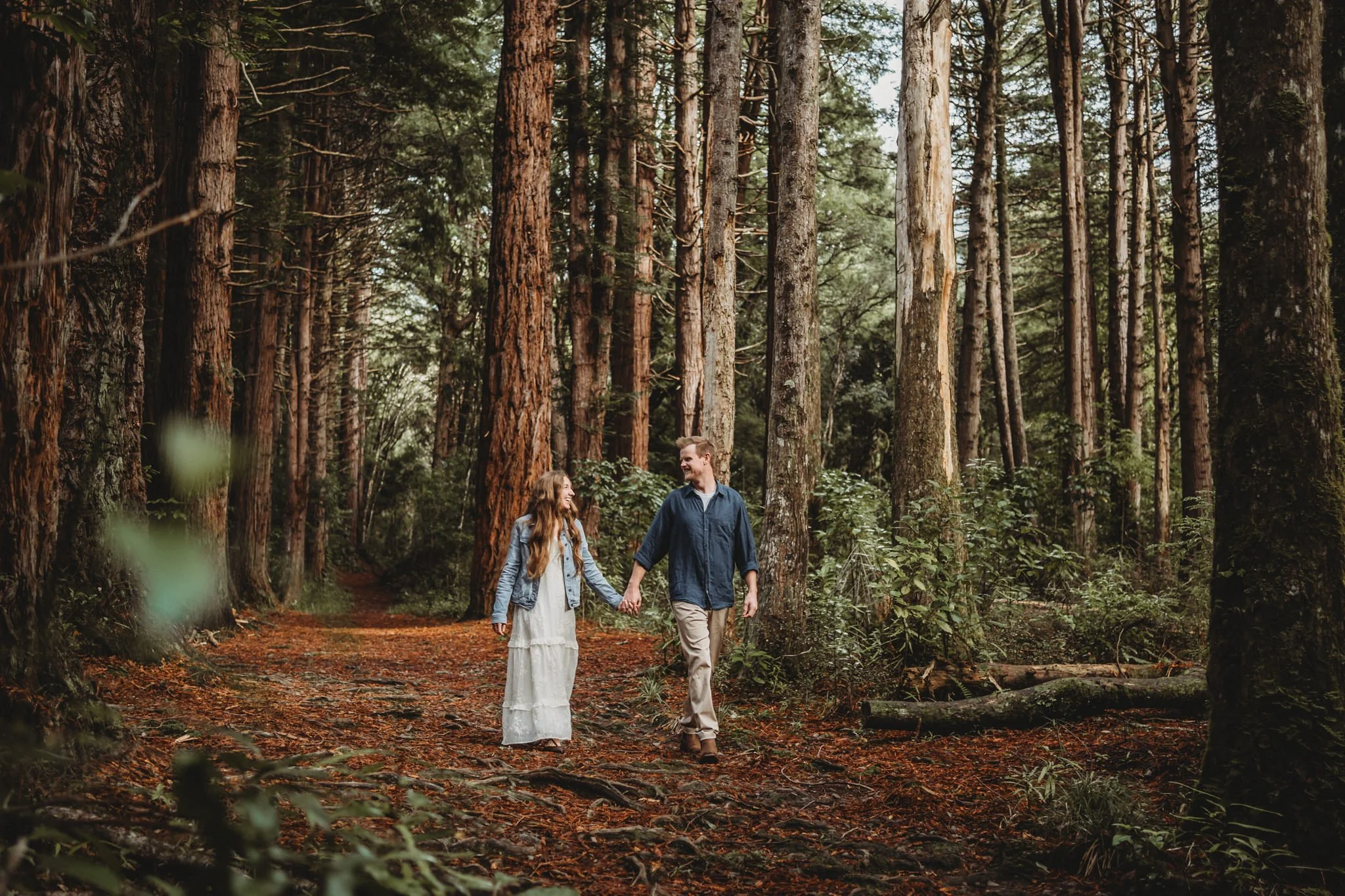 Candid photo of a couple walking hand in hand
