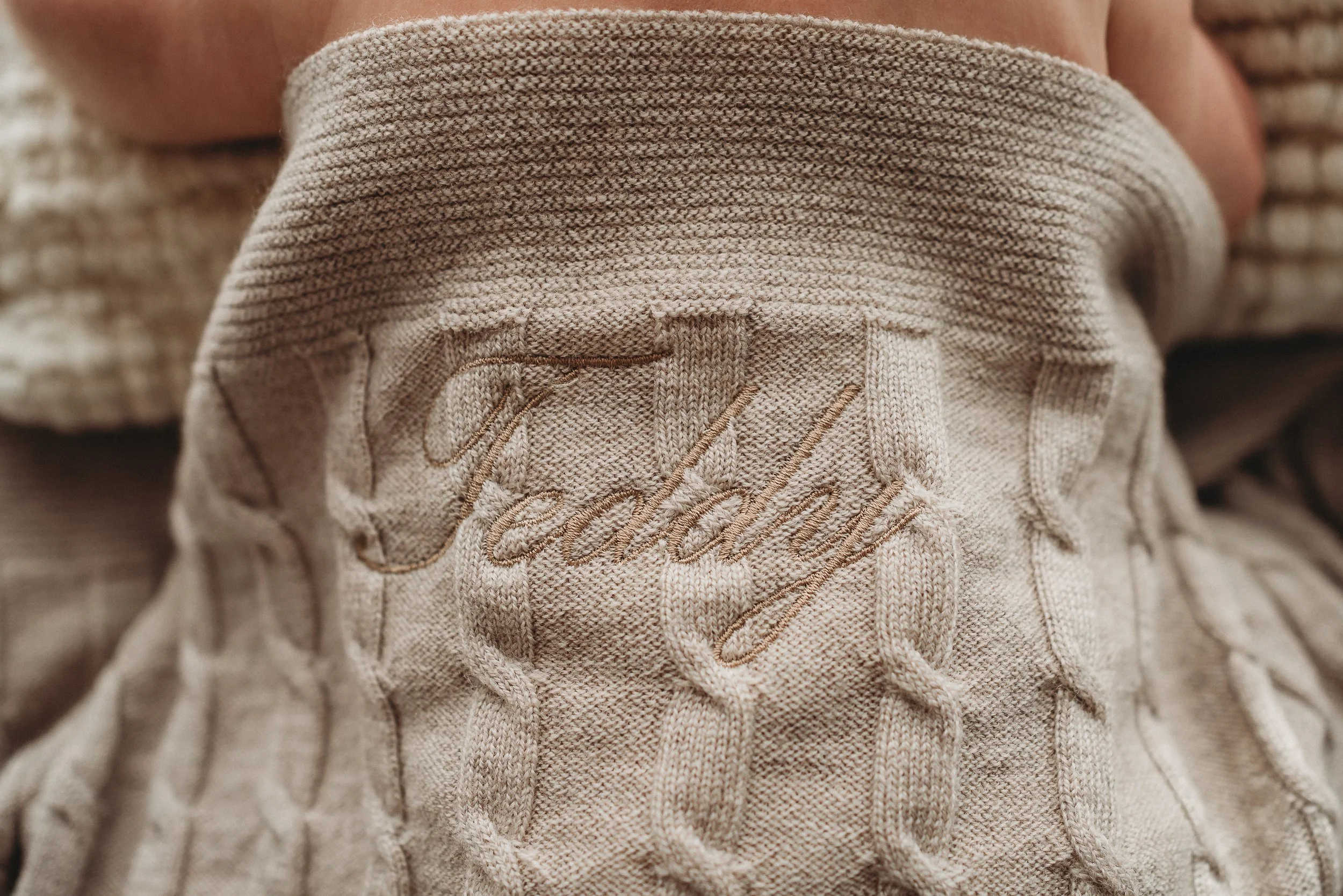 Close up image of embroidery on blanket