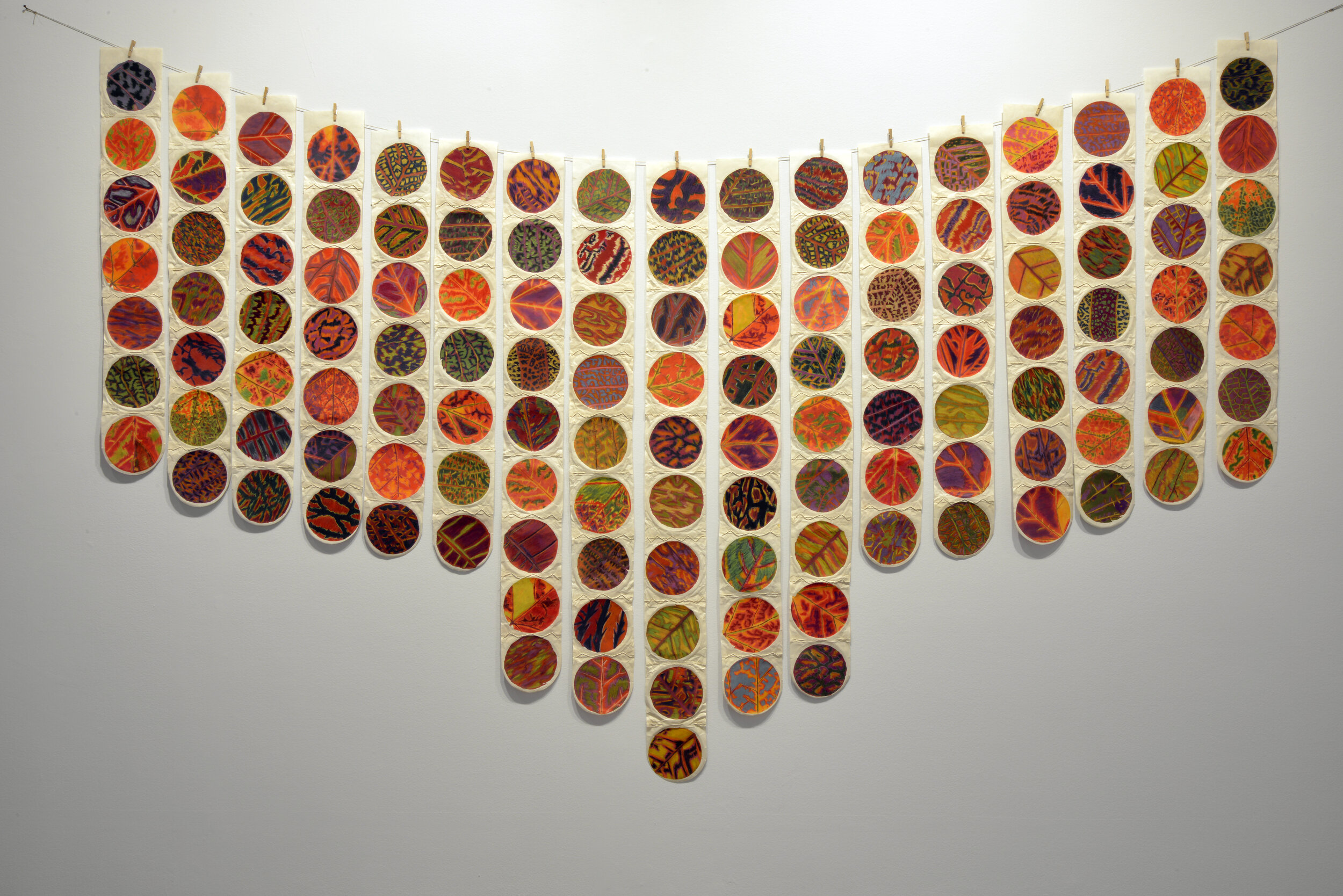  Daphne Boyer,  D’ohor Akouchikaew, Hung Out to Dry, Sur la corde à linge , 2019, photographed leaves printed on Japanese paper, hand tinted with pigmented pencils, handspun paper thread, clothes pins, linen thread.   