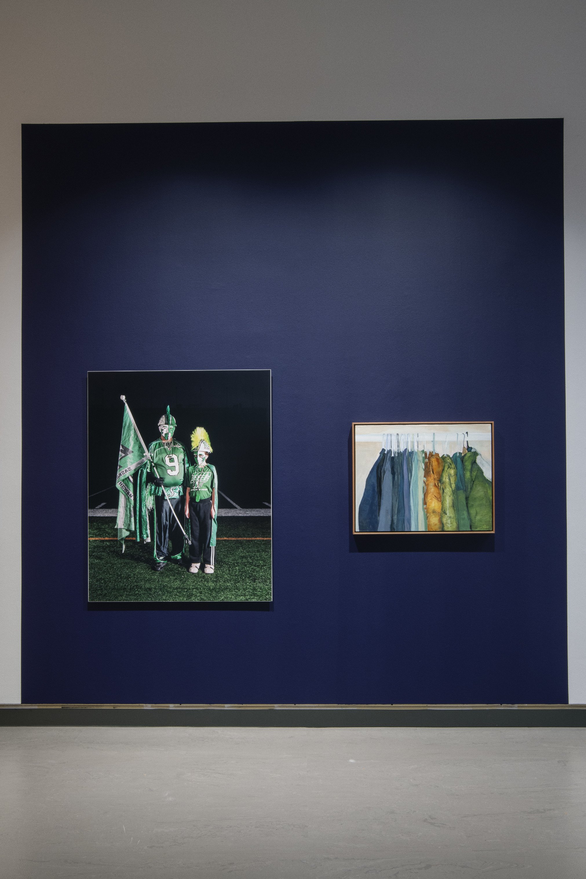  Brenda Pelkey,  Rick and Terry , 2010, chromira print. Collection of RPL Permanent Collection. (Left.)  Mahdi Mahdian,  Settled , 2025, oil on canvas. Collection of SK Arts Permanent Collection. (Right.) 