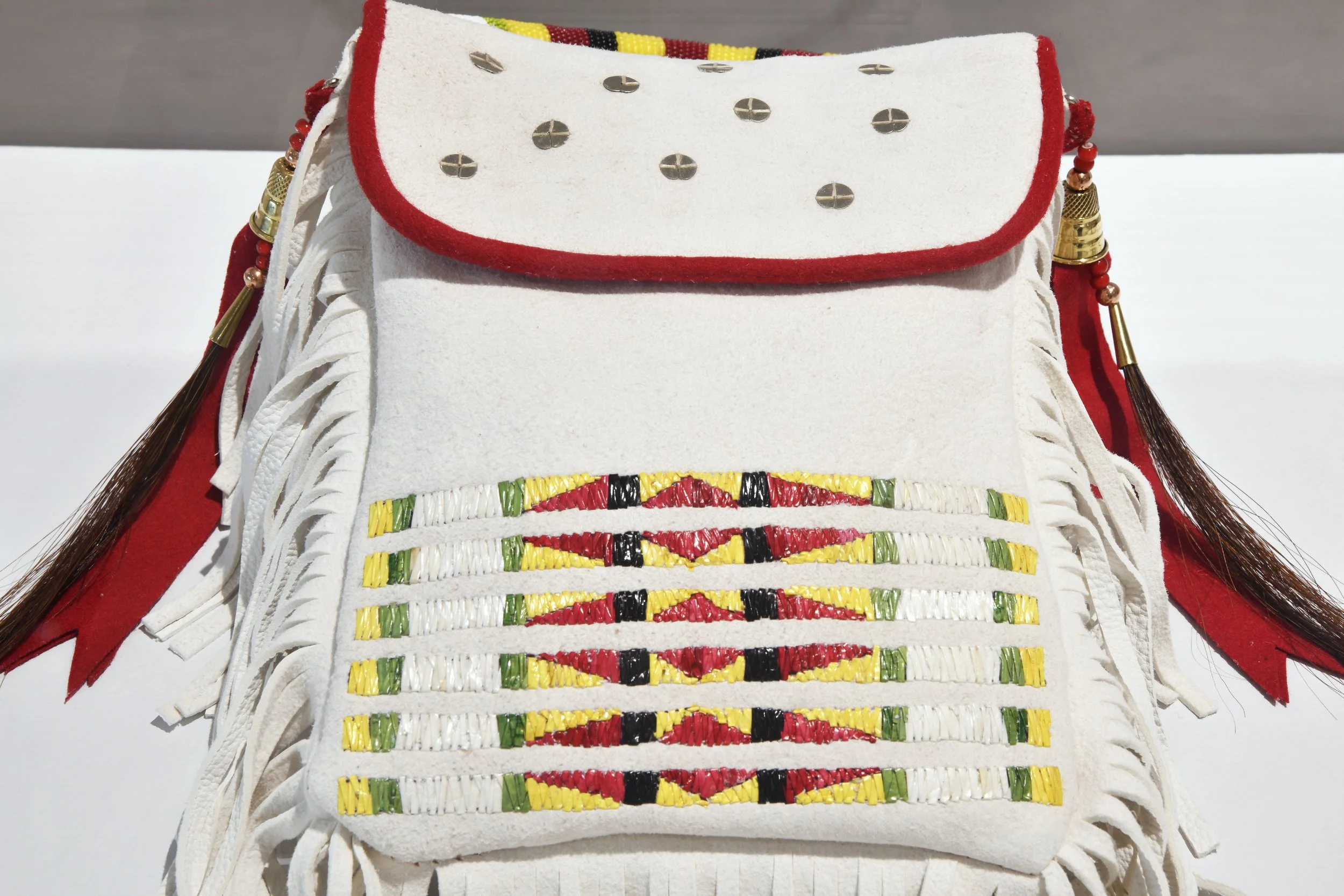  Serene Weasel Traveller,  Kaayaiss (quillwork deer hide bag) , 2026, deer hide, porcupine quills, seed beads, wool, sequins. 