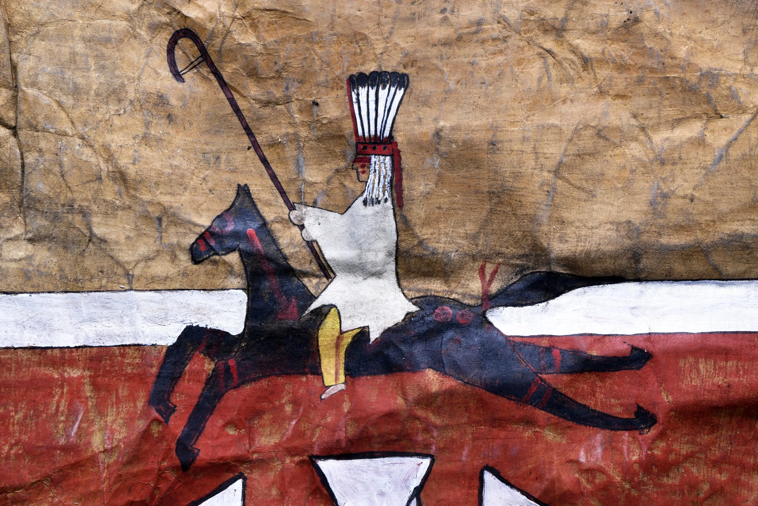  Kiitokii,  Captured Wealth  (detail), 2026, bison hide, ochre, charcoal, acrylic paint. 