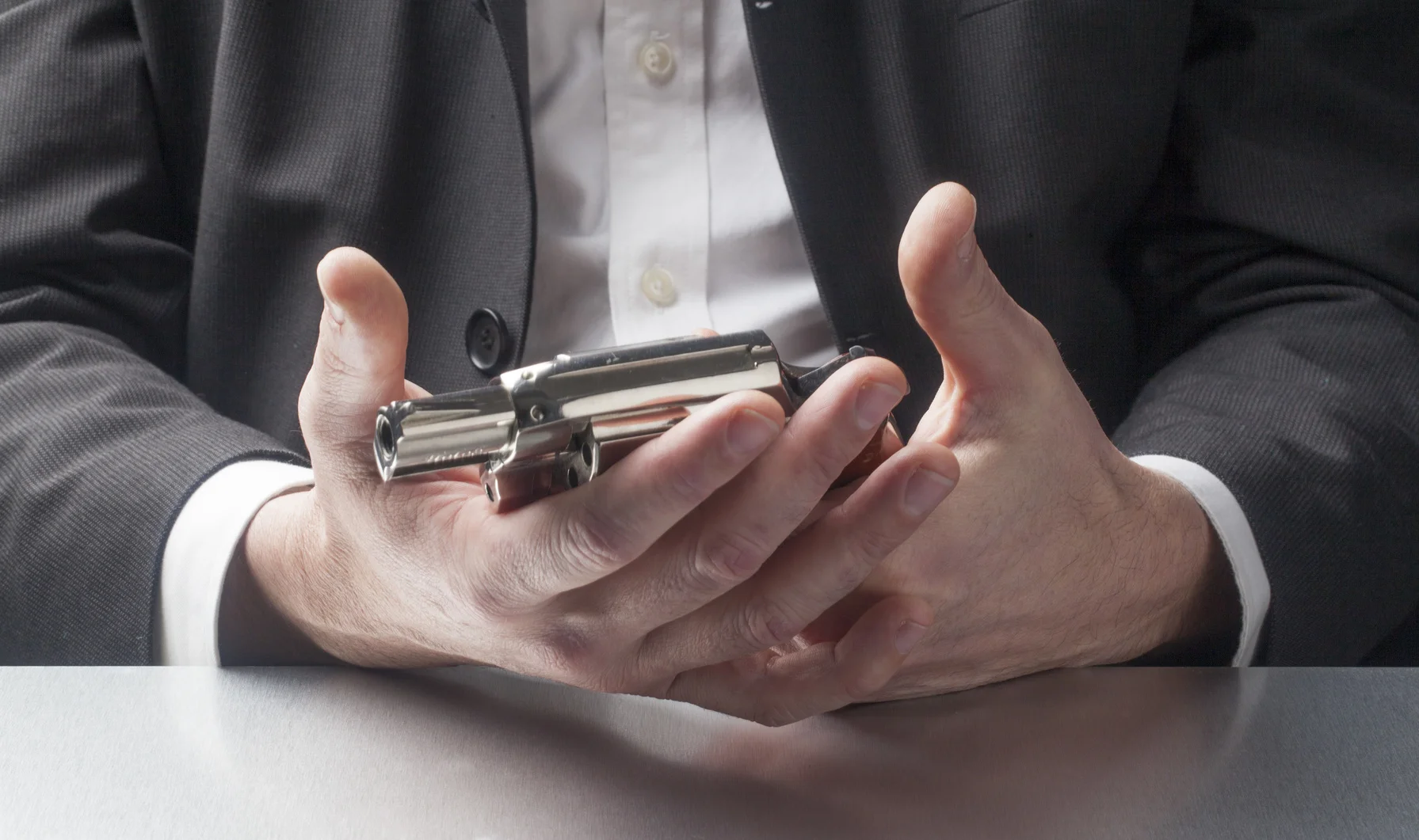employee-holding-hand-gun.jpg
