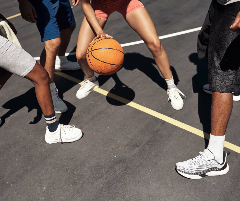 playing basketball on asphalt court