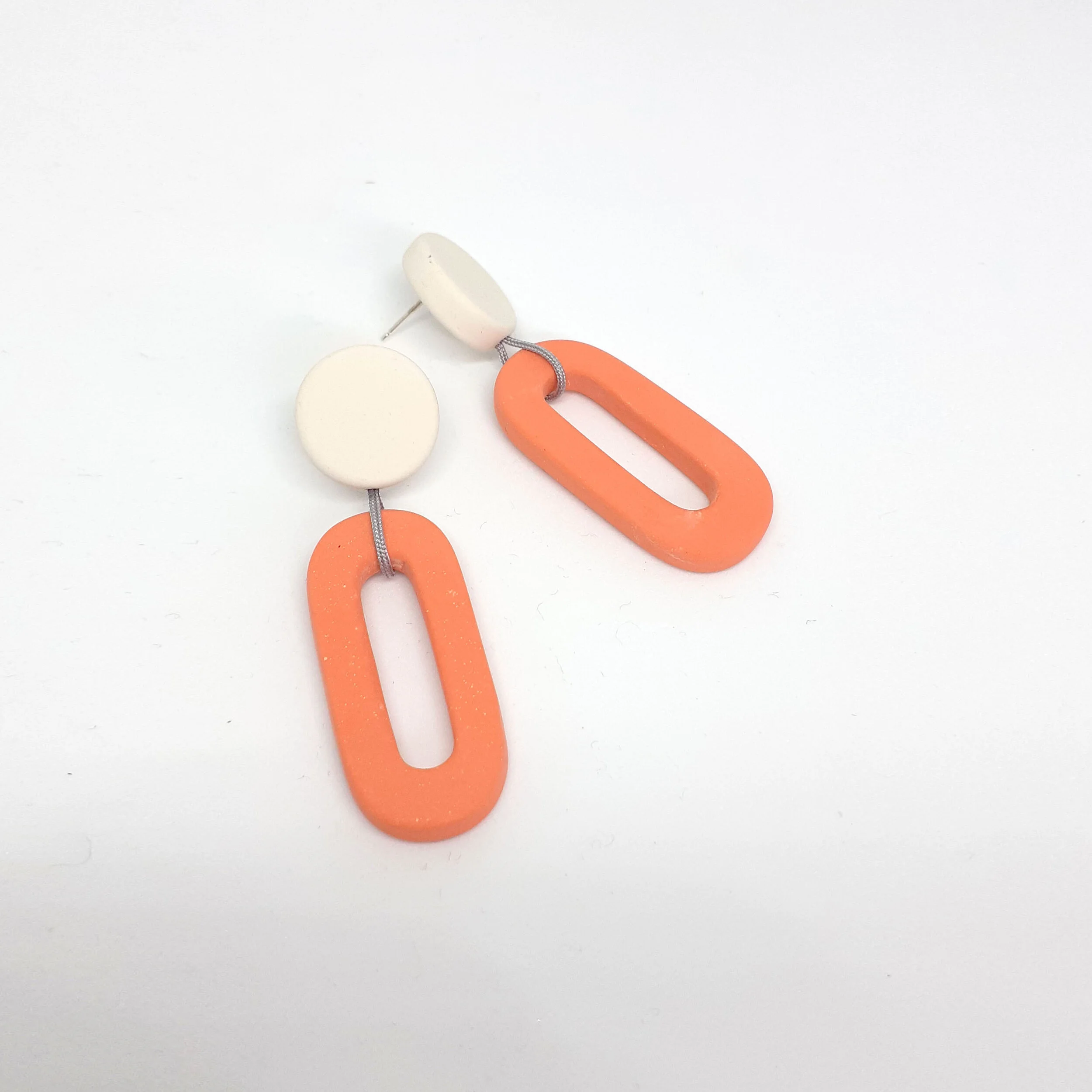 ETSYdotloopearringswhiteorangegreycord.jpg