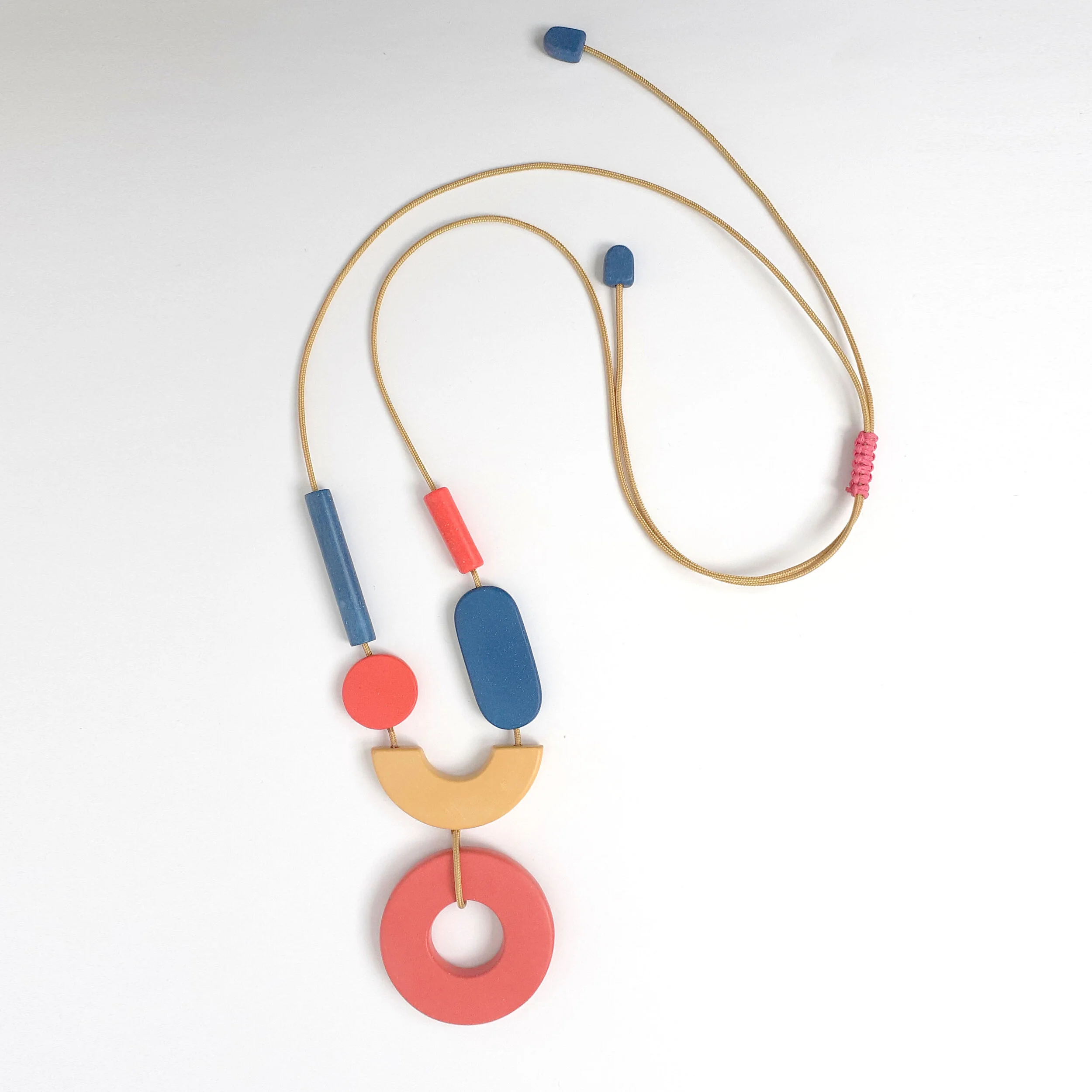 ETSYmultishapehoopnecklaceyellpinkblueTOPVIEW.jpg