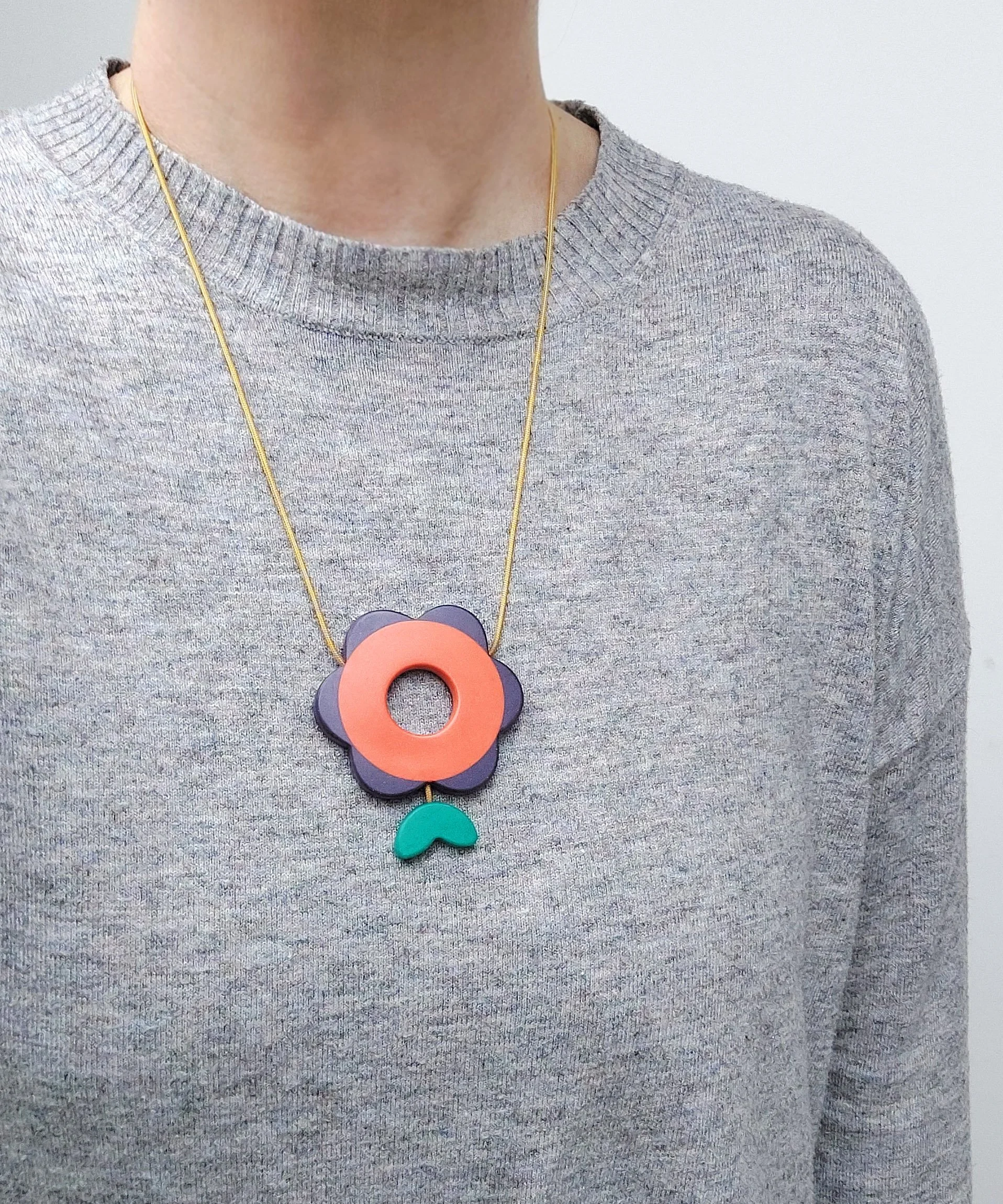 FlowerPowerPendOrangePurpleWorn.jpg