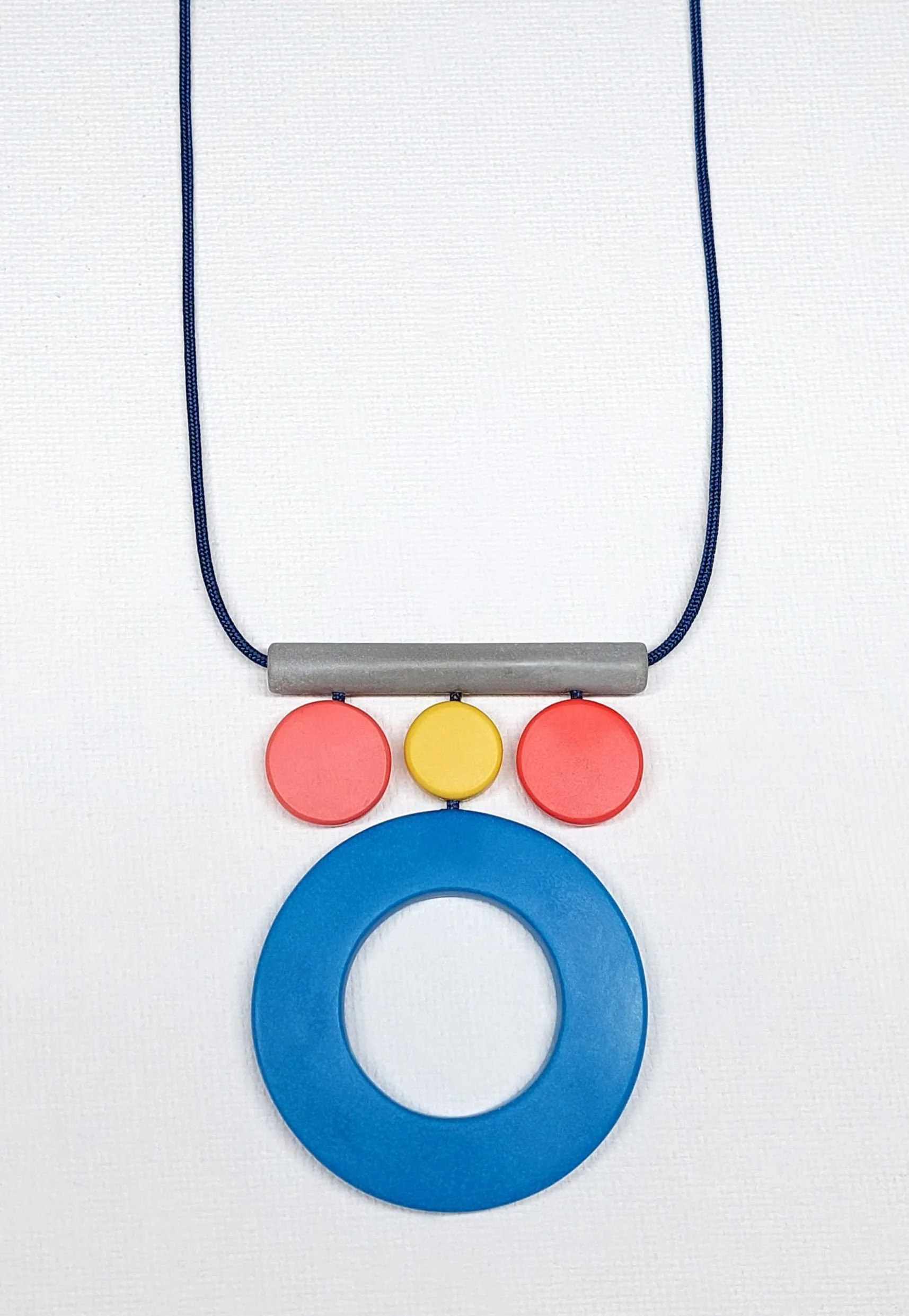 GeoPatternPendantGreyBluePinkYellow.jpg