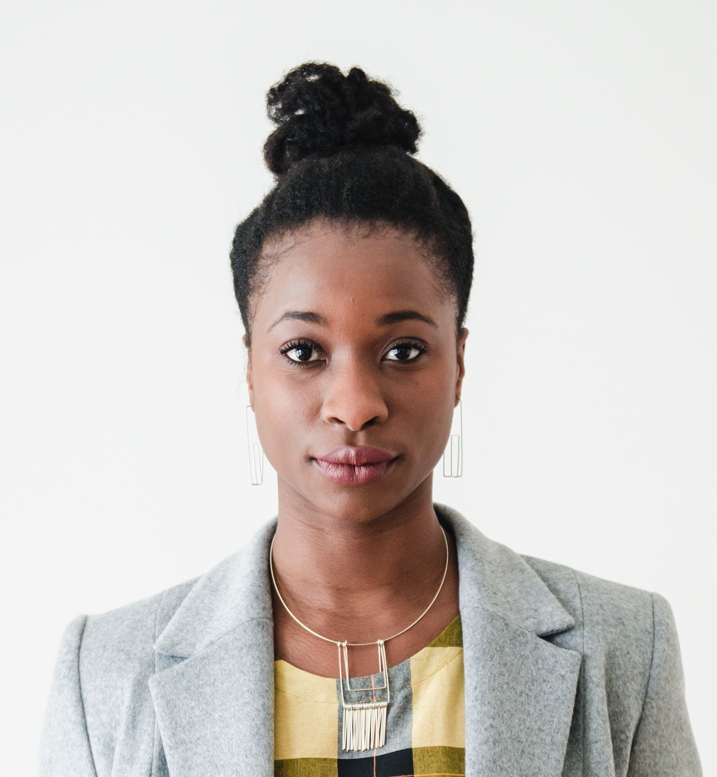 Wire Fringe Pendant Set Necklace & Skyscrapers Earrings: Kari Woo Yellow and Black Check Dress: Ten Thousand Villages Two Button Overcoat: Anneke Forbes Photography: Ally C Tran | Model: Sade Babatunde