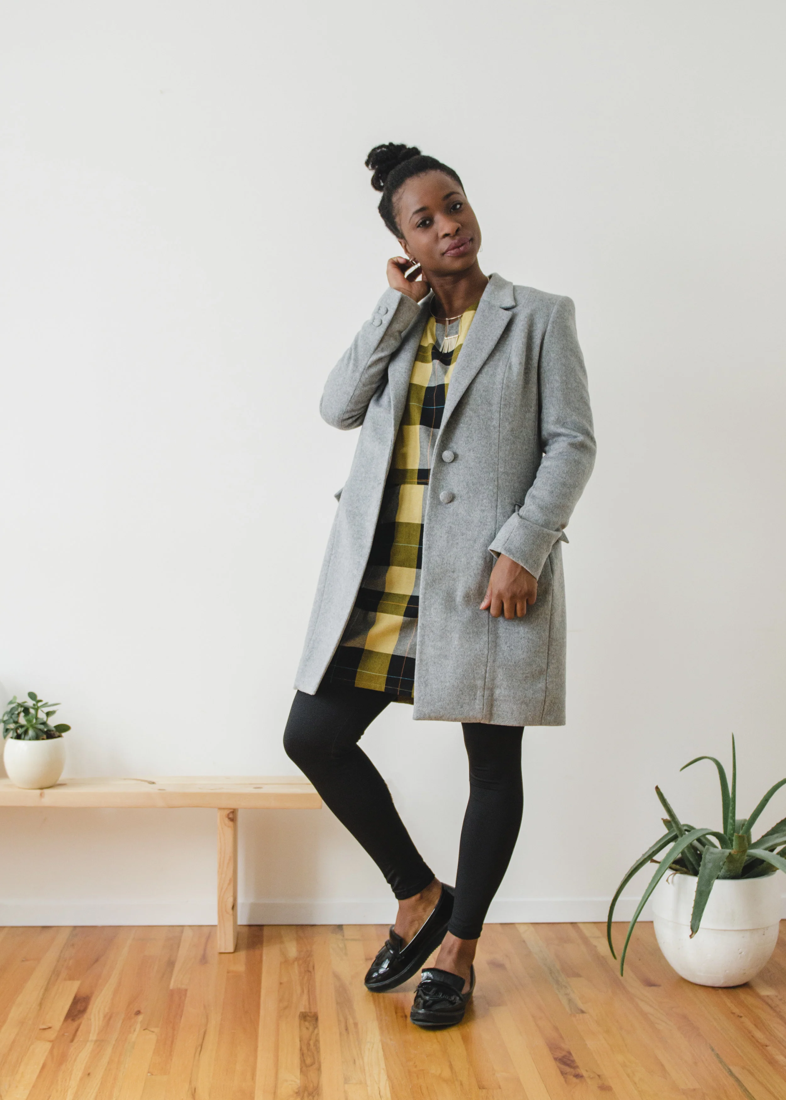 Two Button Overcoat: Anneke Forbes Yellow and Black Check Dress: Ten Thousand Villages Wire Fringe Pendant Set Necklace & Skyscrapers Earrings: Kari Woo Photography: Ally C Tran | Model: Sade Babatunde