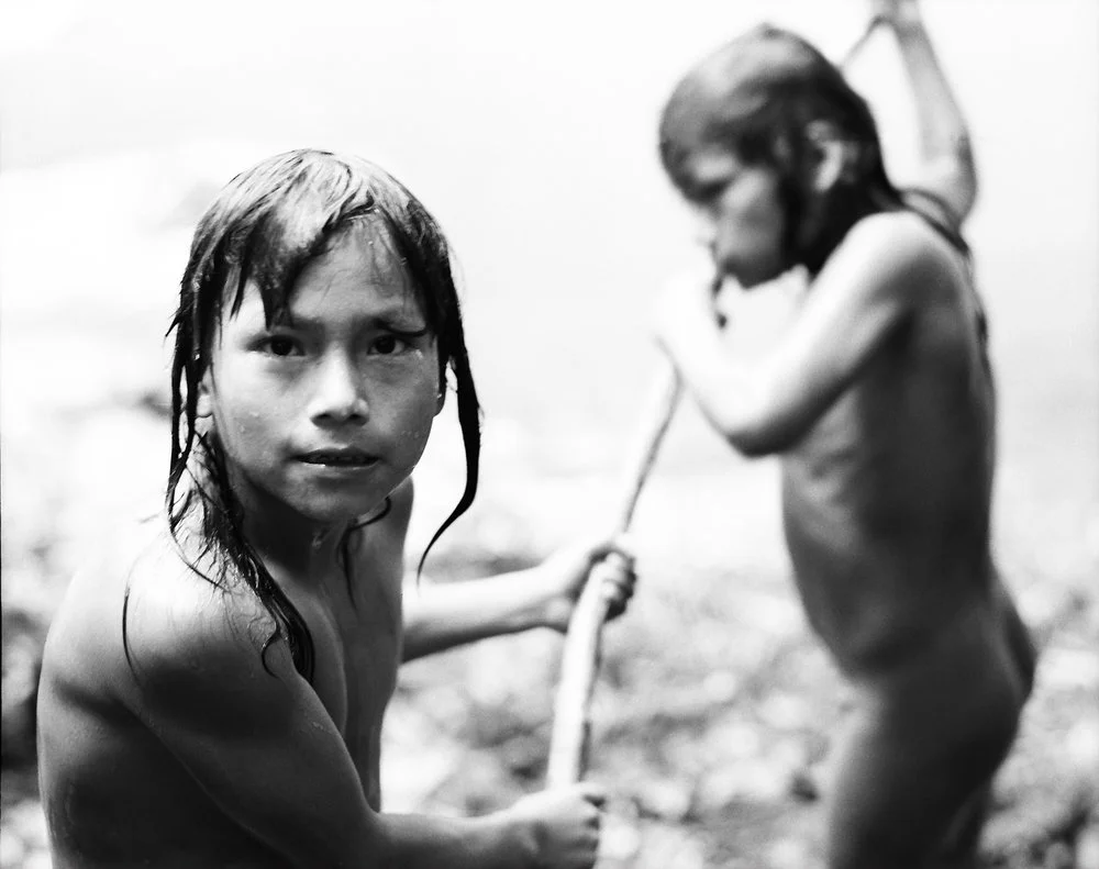 Kunang and Wichin working on their canoe. This are the two sons of chief Elias from the tribe of the Chuars.