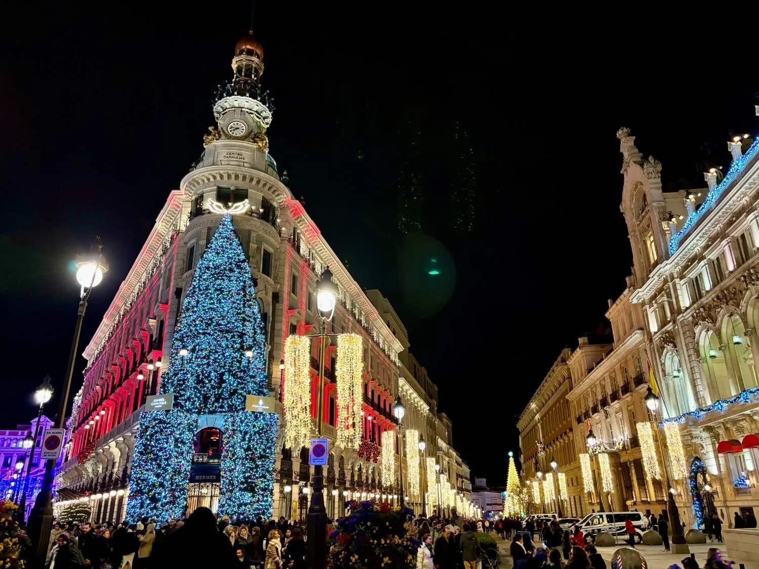 Christmas lights adorn Madrid's historic buildings, making the city a excellent and festive destination for holiday travelers.