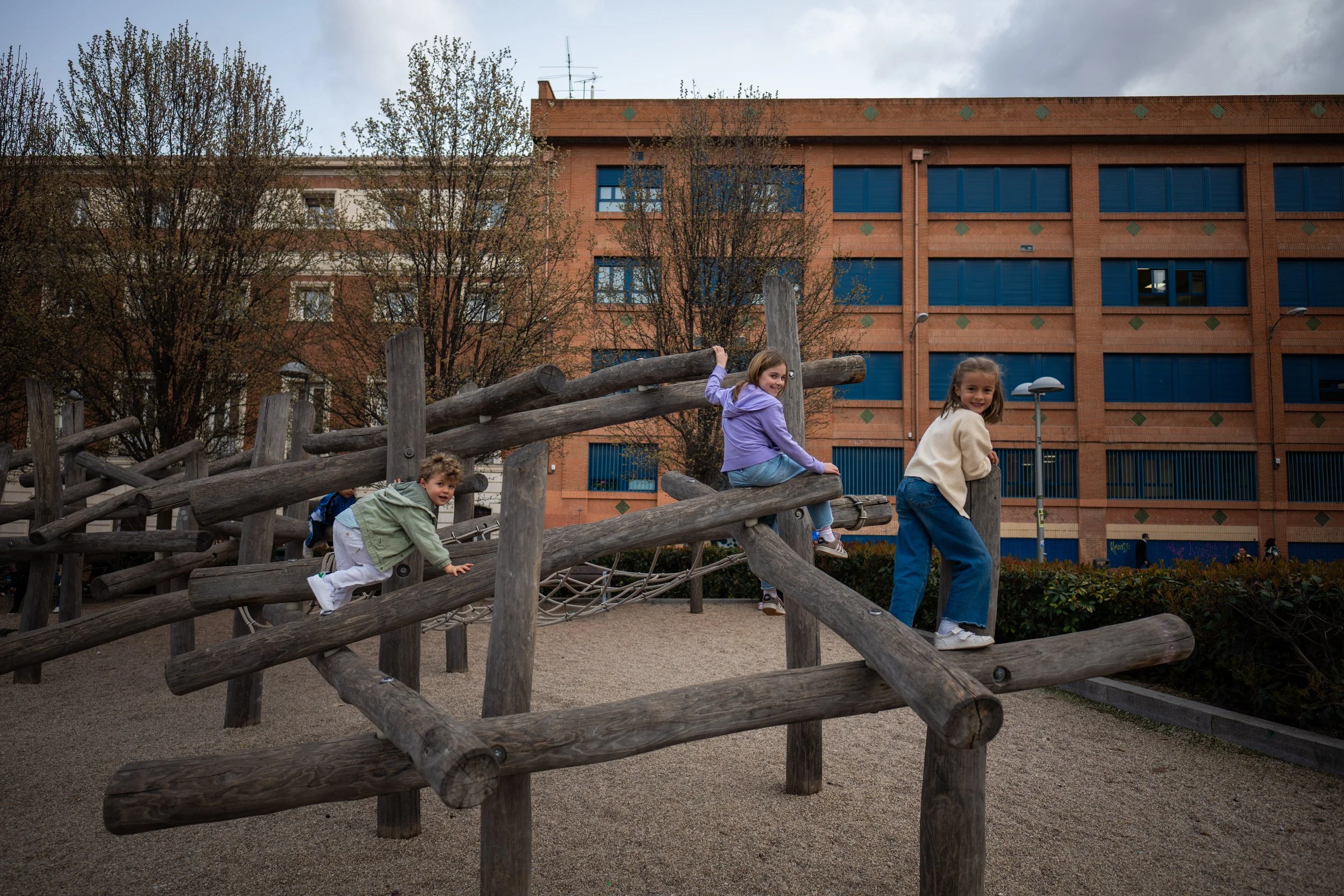 Kids play on a playground in one of Madrid's plazas.