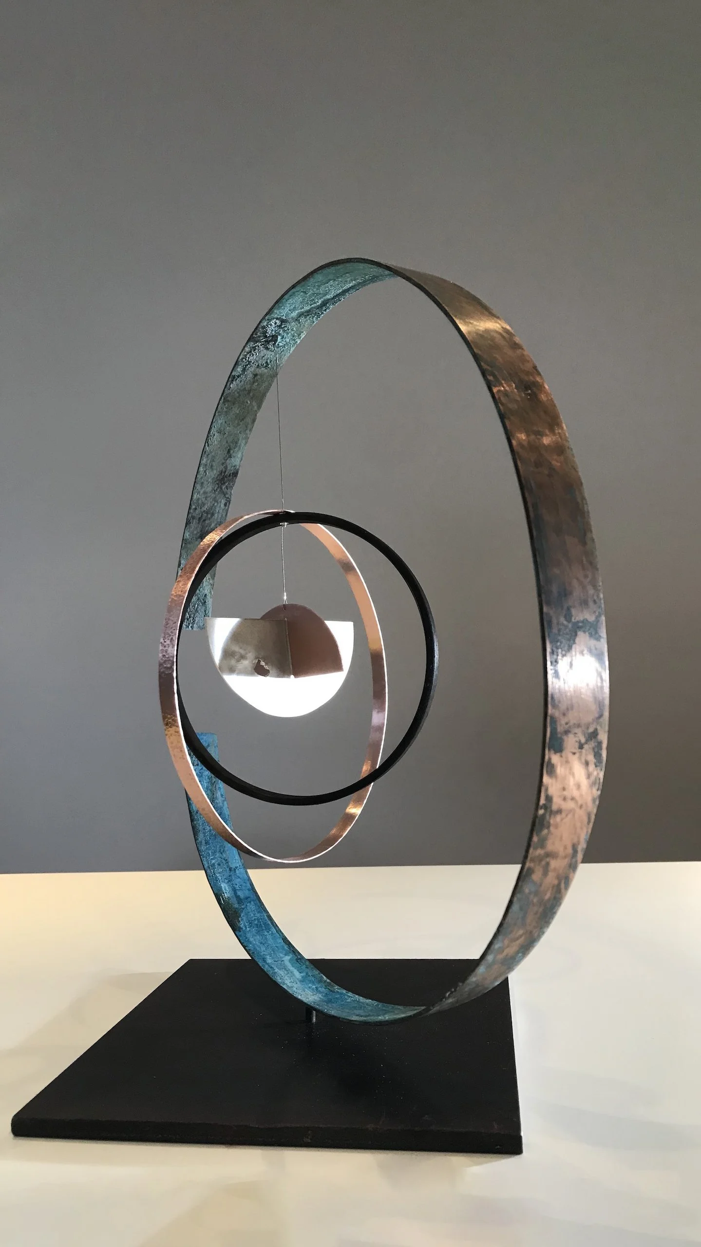 WEBSITE_ORBITAL#3_2022_40X40X40CM_STANDING MOBILE SCULPTURE_COPPER,STERLING SILVER,WOOD,STEEL_2KG_1000(£) ANGLE.jpeg