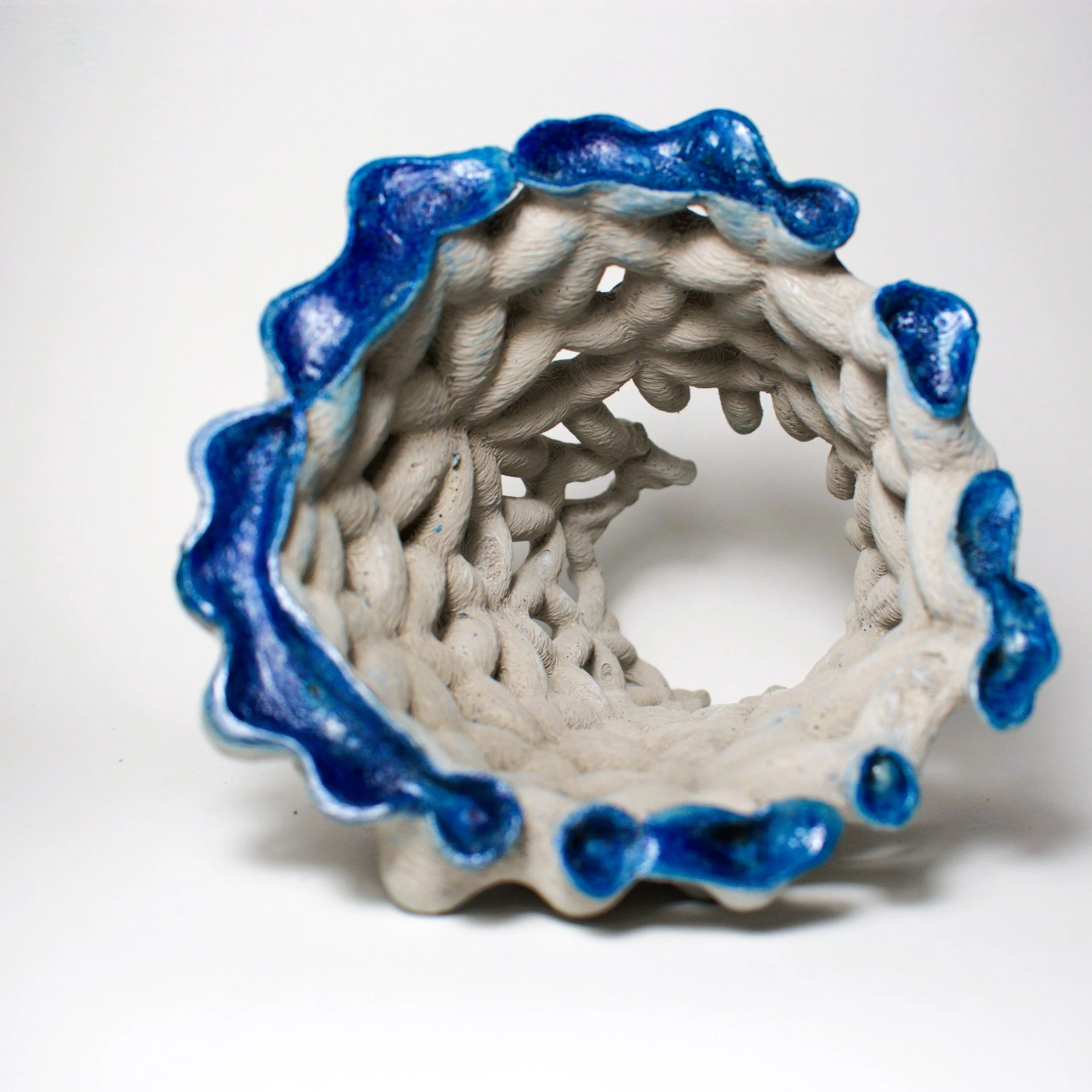 EnchantedMatter_FragmentsOfAFutureMythology1BaseView_2025_ConcreteAndEnamel_12x12x12cm.jpg